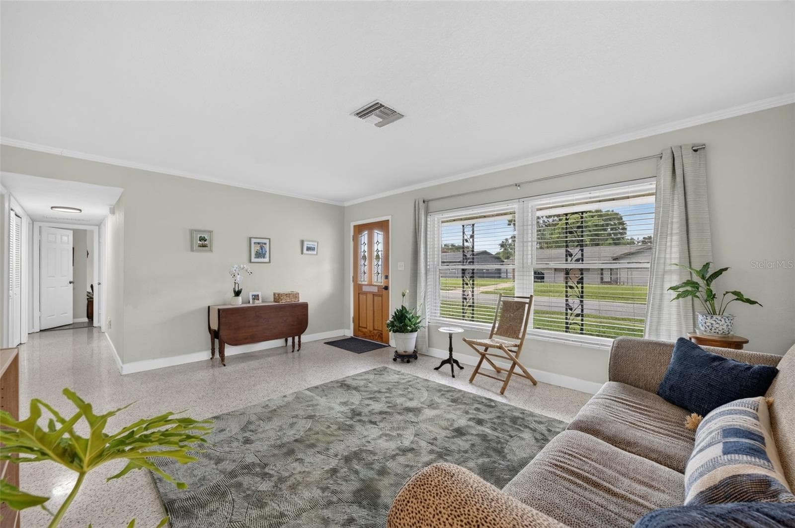 Living showcasing large windows to bring in lots of light to home - 619 MARSHALL ST, ALTAMONTE SPRINGS