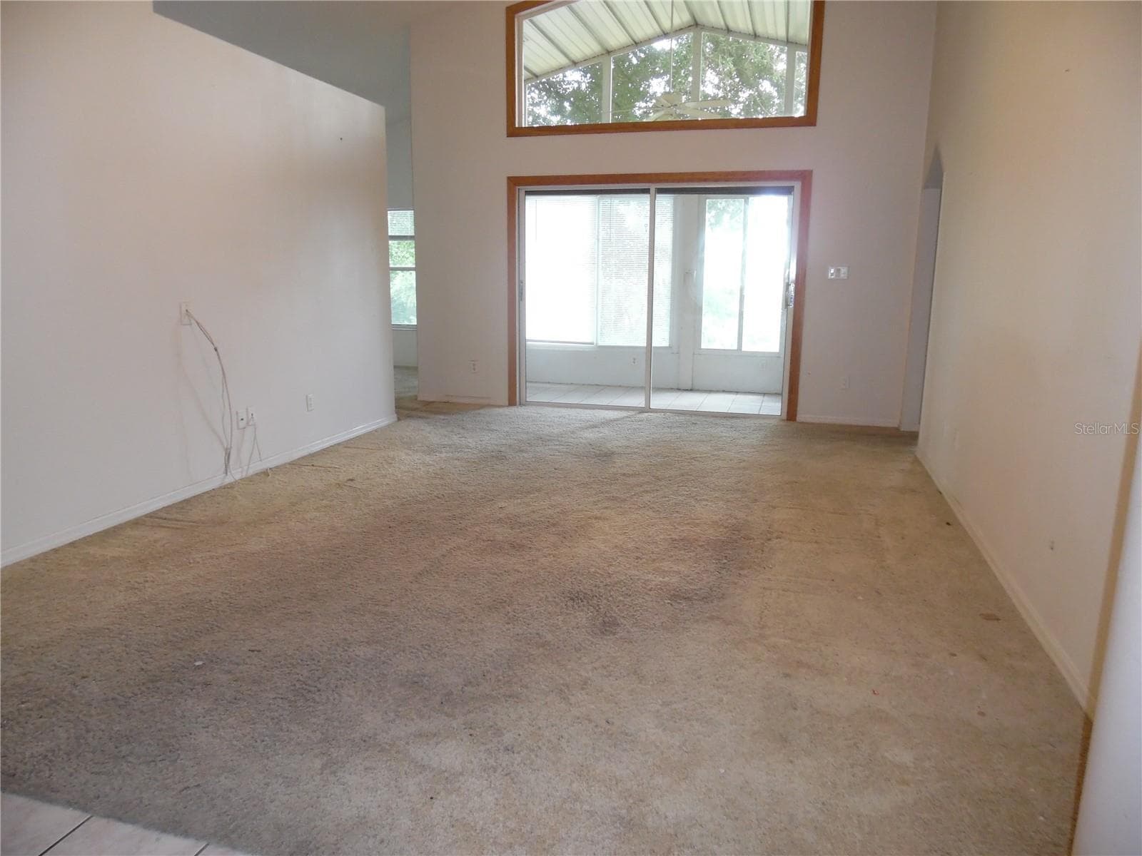 Living Room looking out over the golf view - 24947 CRANES ROOST CIR, LEESBURG
