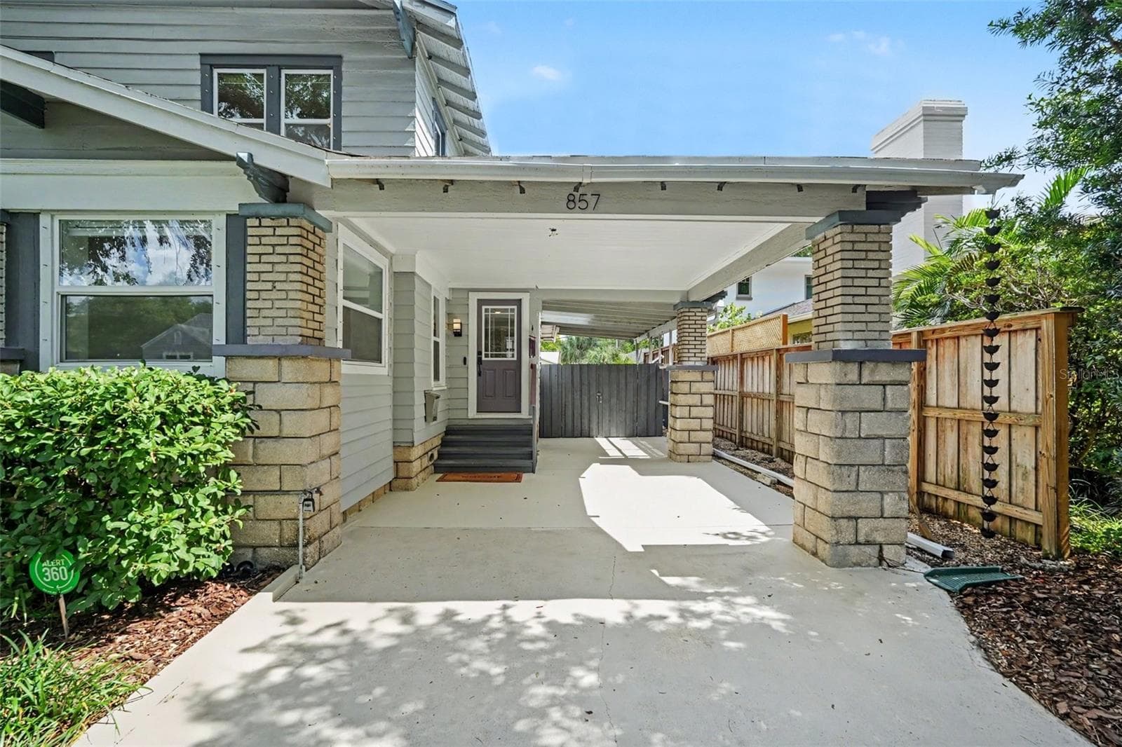 The tandem carport offers exceptional everyday convenience while preserving the home’s distinctive historic character. - 857 21ST AVE N, ST PETERSBURG