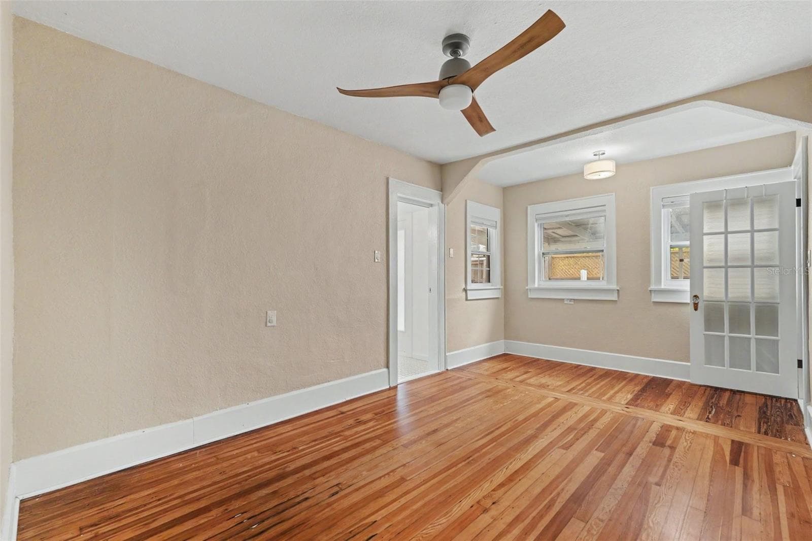 Original heart pine floors and timeless architectural details bring warmth and character to the first-floor room that can be used as a guest room, home office, den, or private retreat. - 857 21ST AVE N, ST PETERSBURG