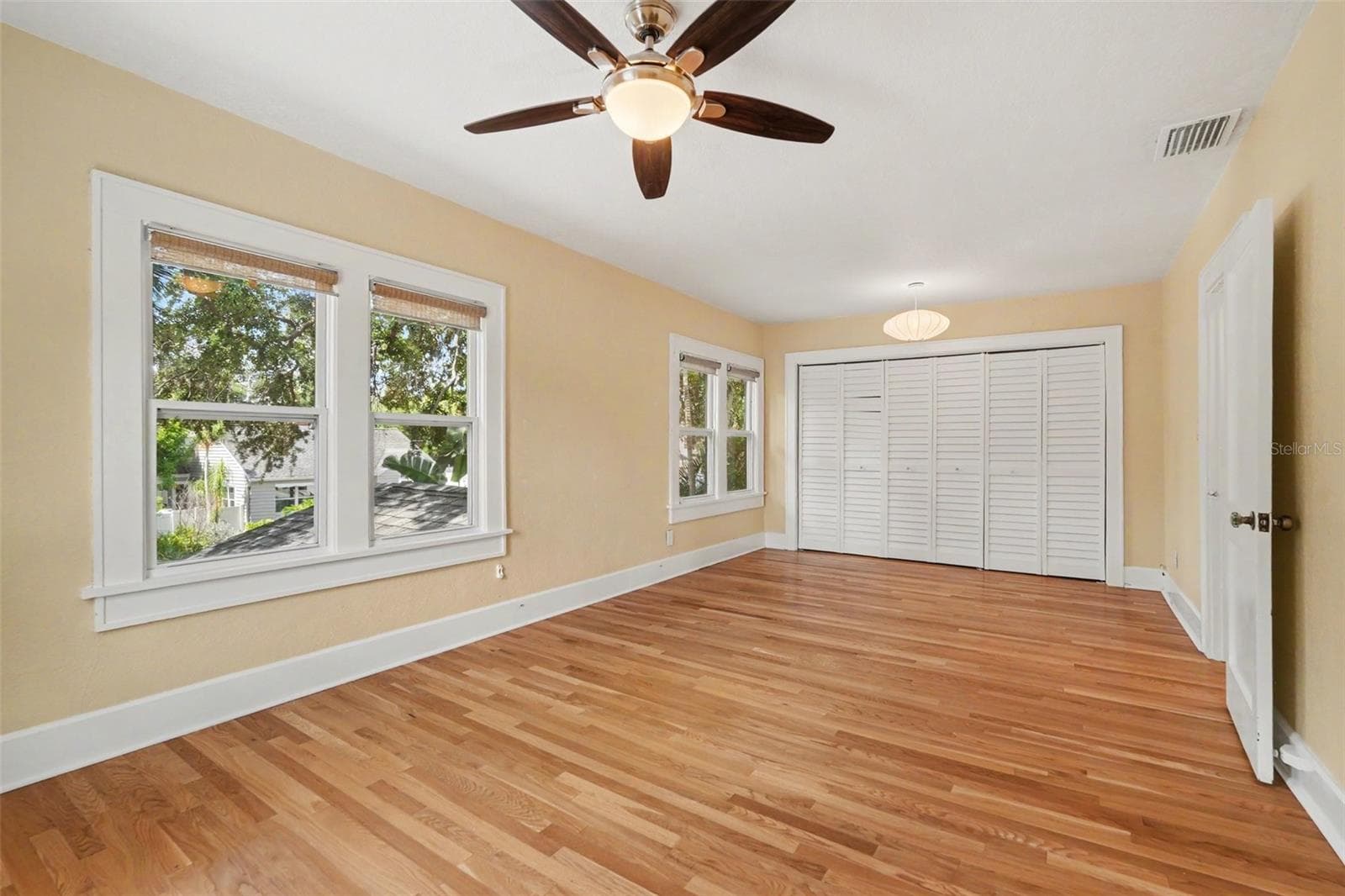 Upstairs, the spacious primary bedroom offers abundant natural light, generous storage, and room to truly unwind. - 857 21ST AVE N, ST PETERSBURG