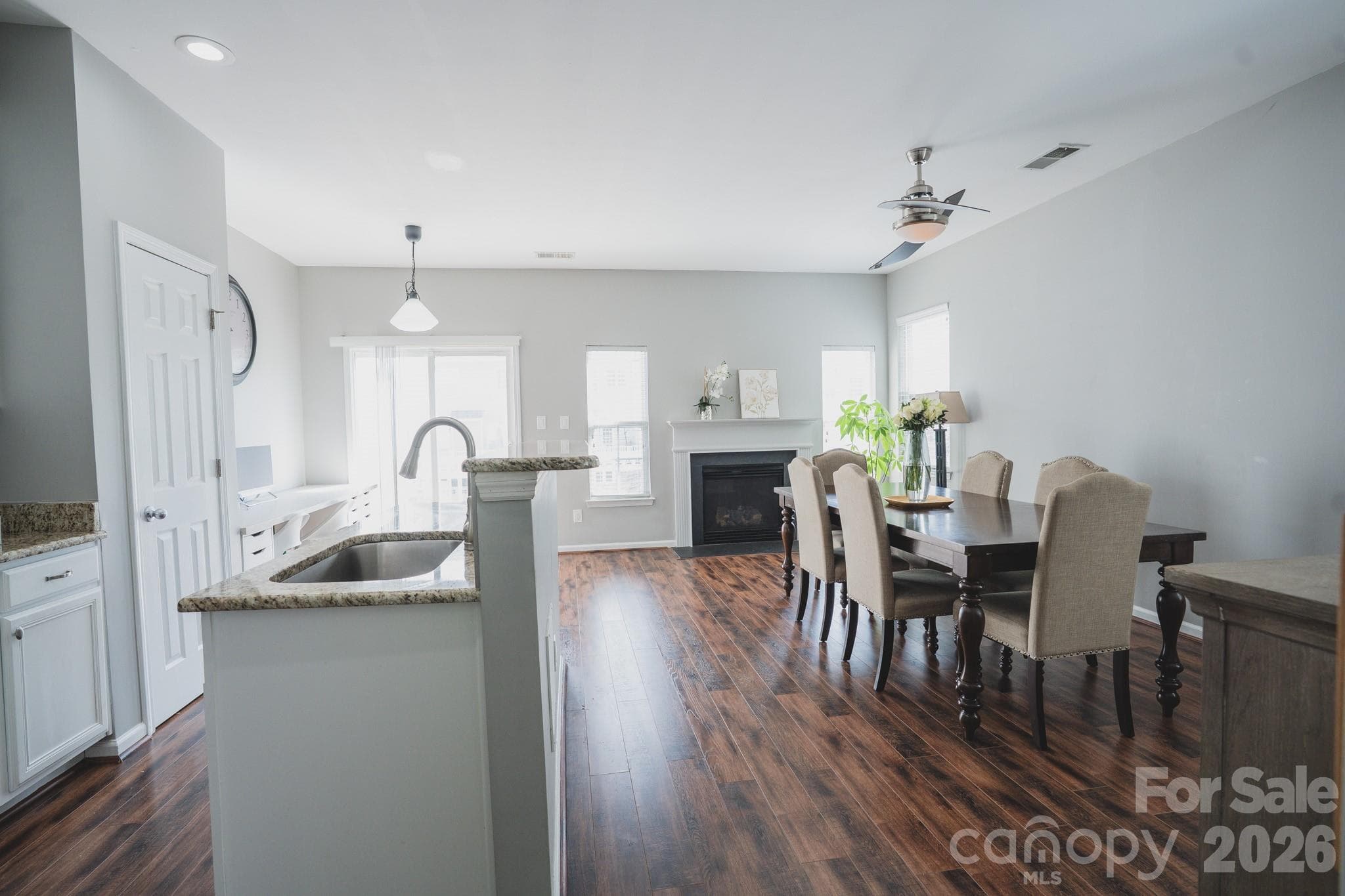 An open floor with a  cozy gas fireplace. - Charlotte