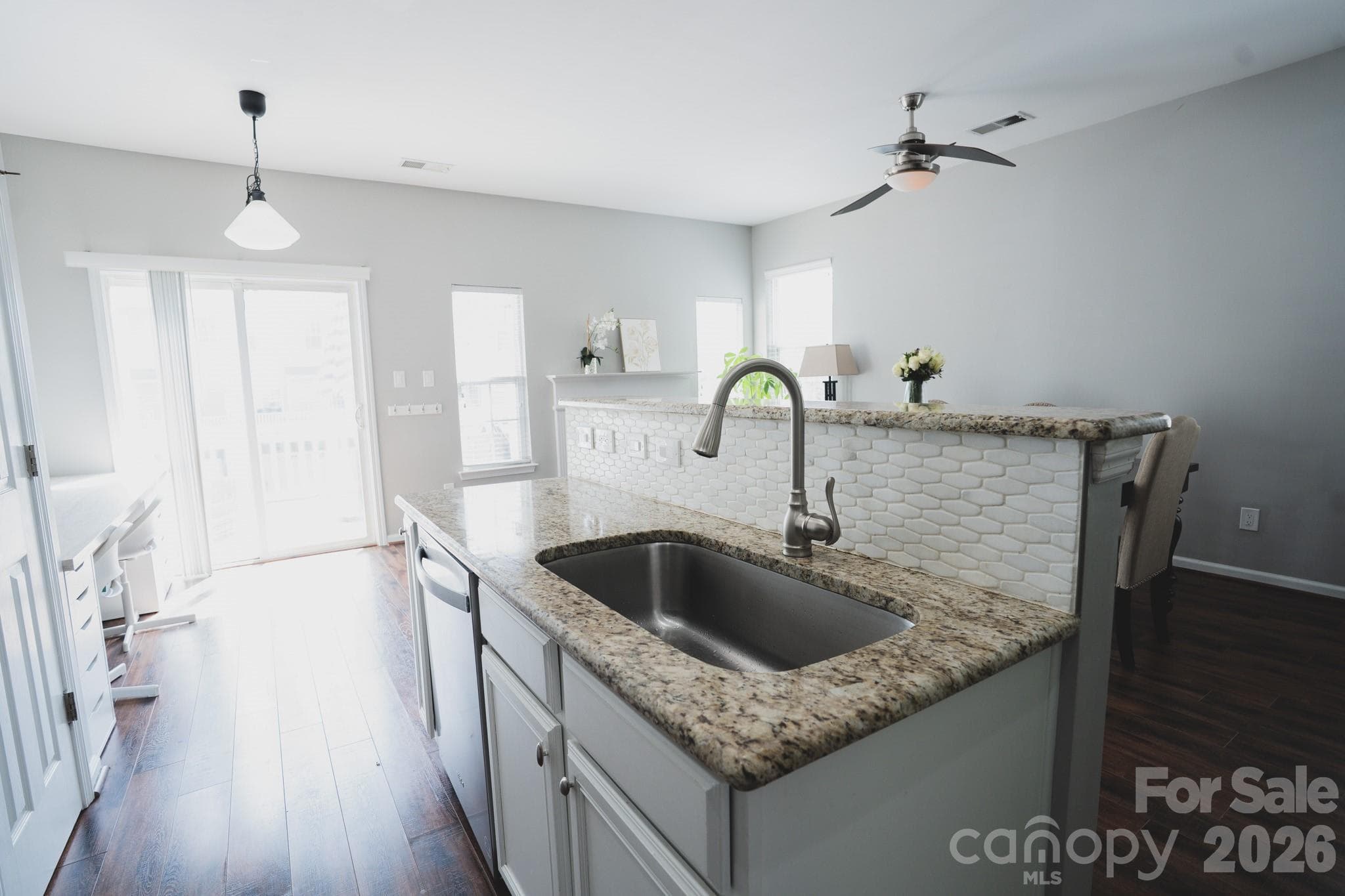 Granite counter tops and an updated backsplash. - Charlotte