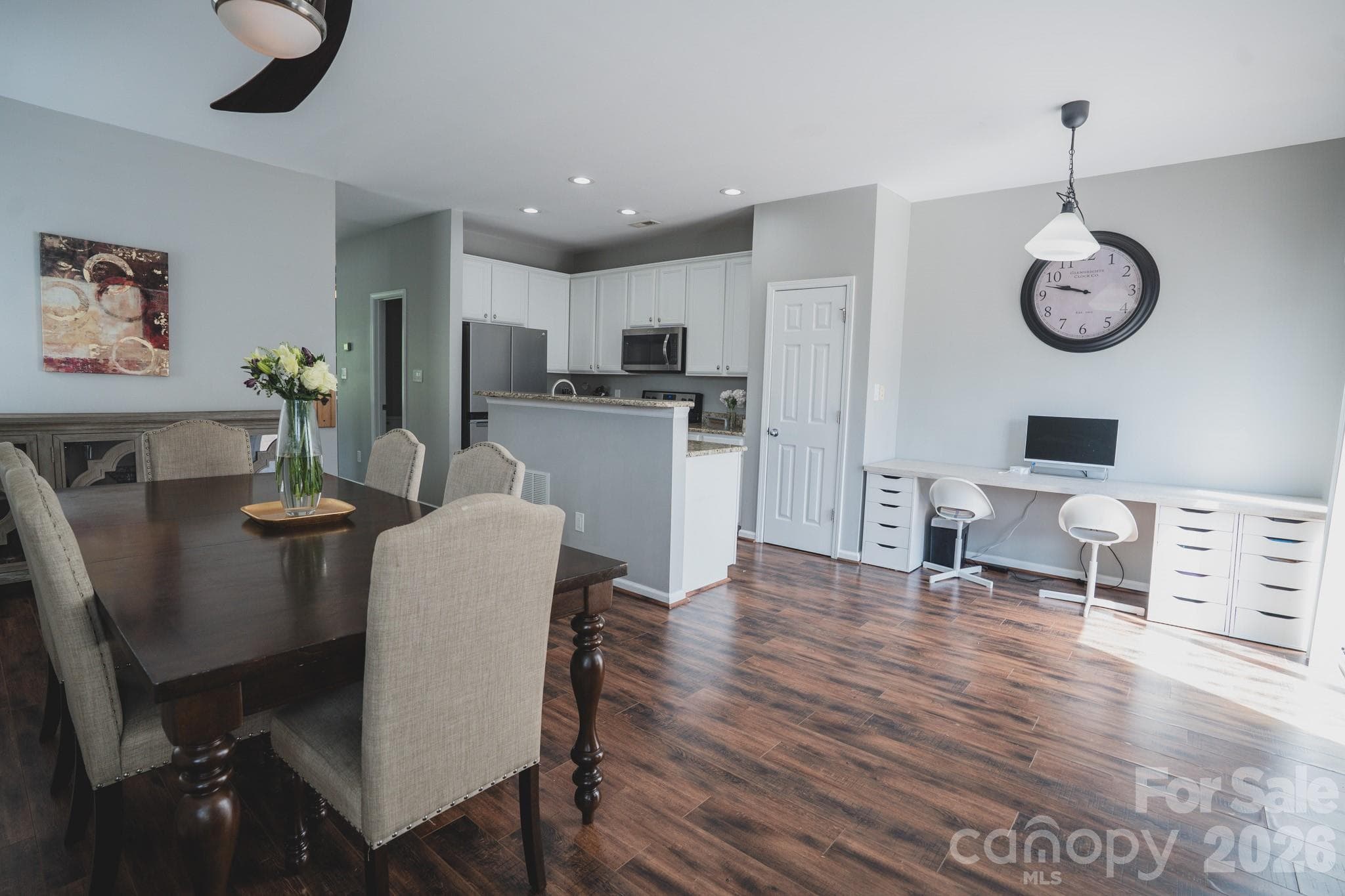 There is even room for a desk or place your table under the light by the clock and add a sofa where the table is located - Charlotte