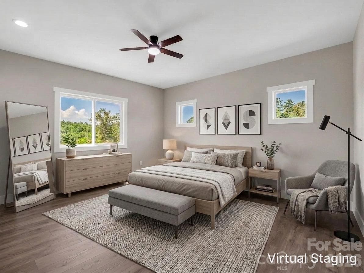 Primary suite filled with abundant light, hardwood floors, insulated windowsVirtually Staged to allow buyers to envision the space - Hendersonville