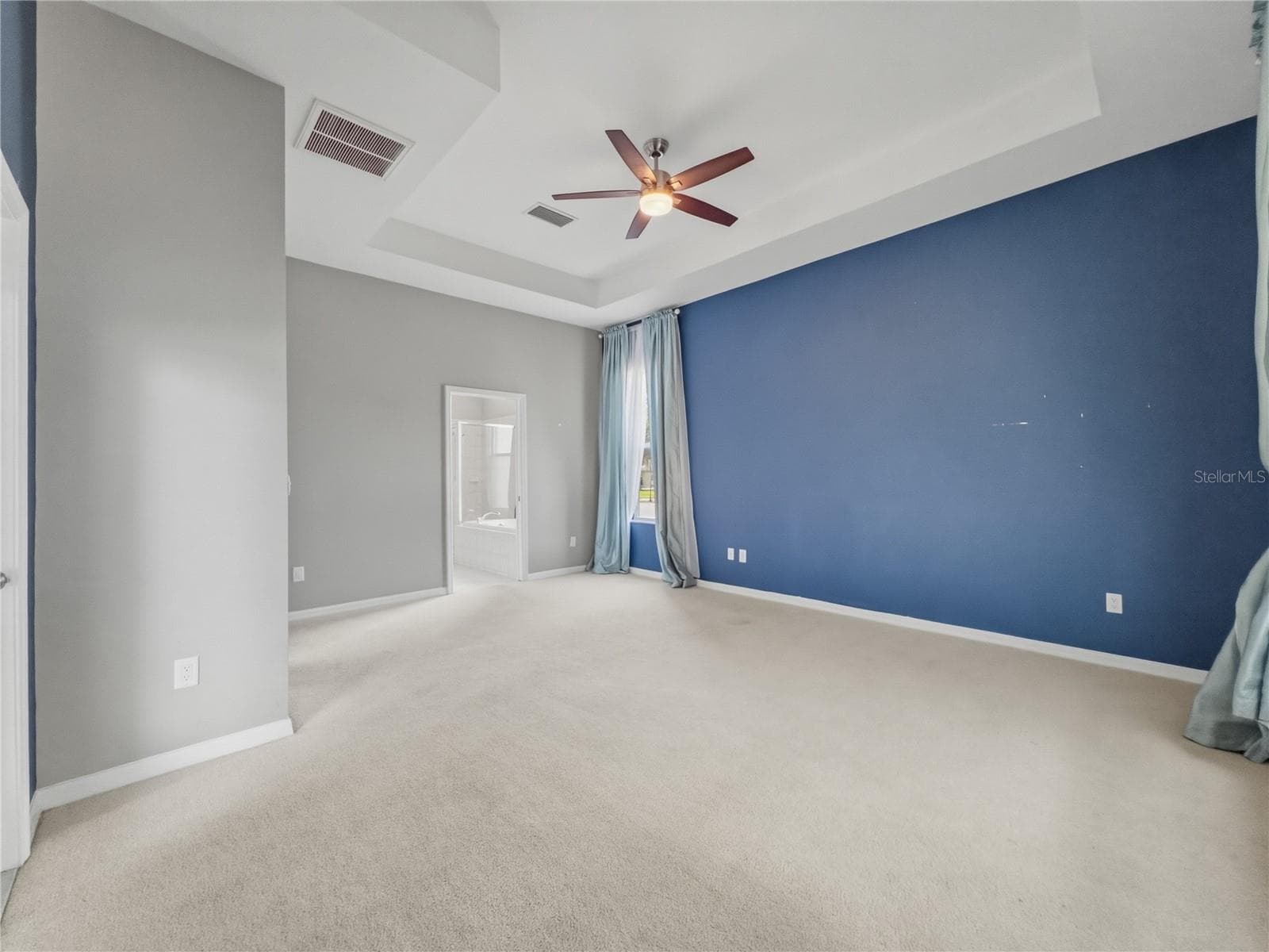 Primary Bedroom toward ensuite - 11530 Oyster Bay Circle, New Port Richey, FL 34654 - 11530 OYSTER BAY CIR, NEW PORT RICHEY