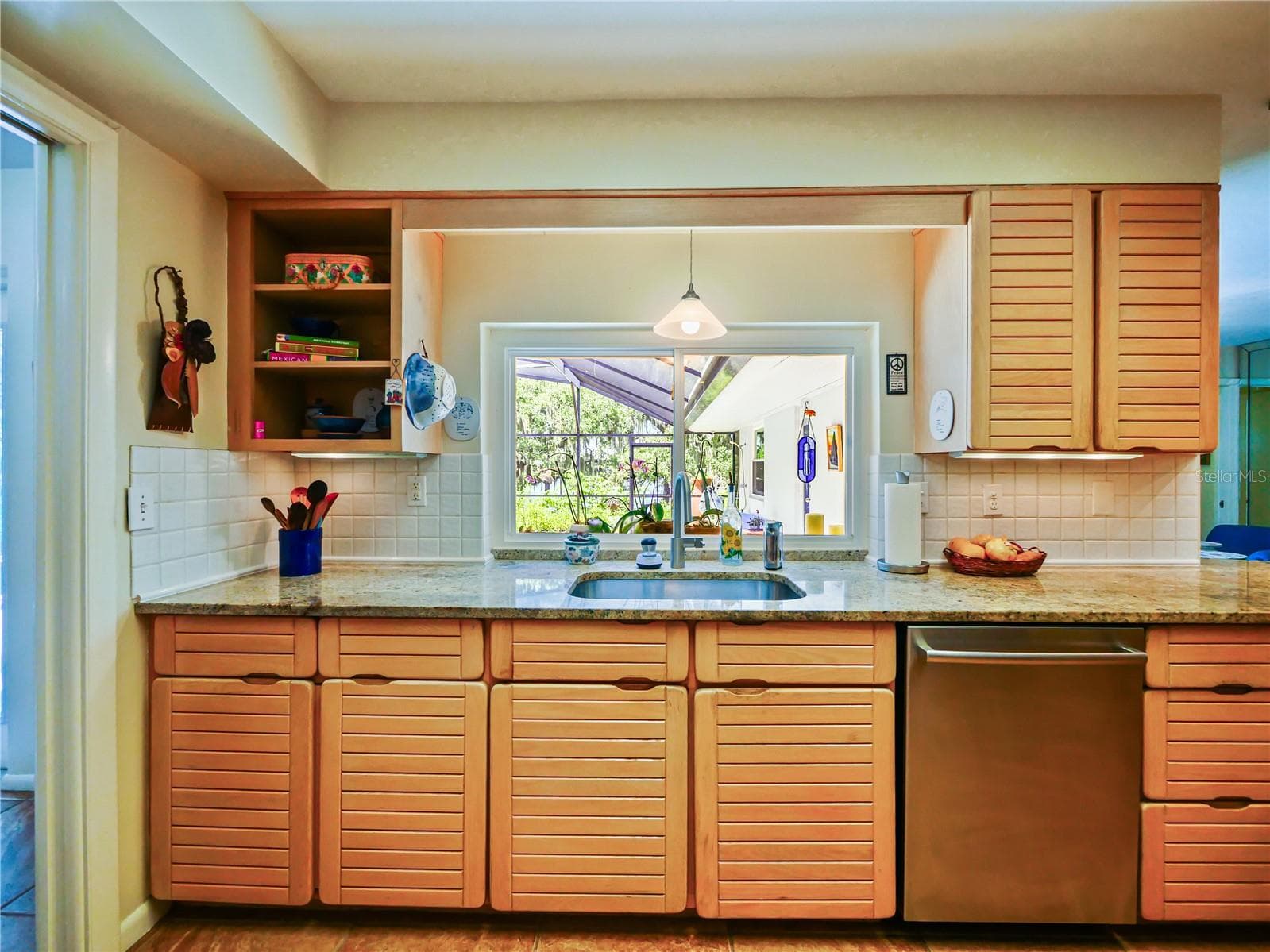 KITCHEN / WINDOW PASS-THROUGH - 5701 CROSS FOX LN, OVIEDO