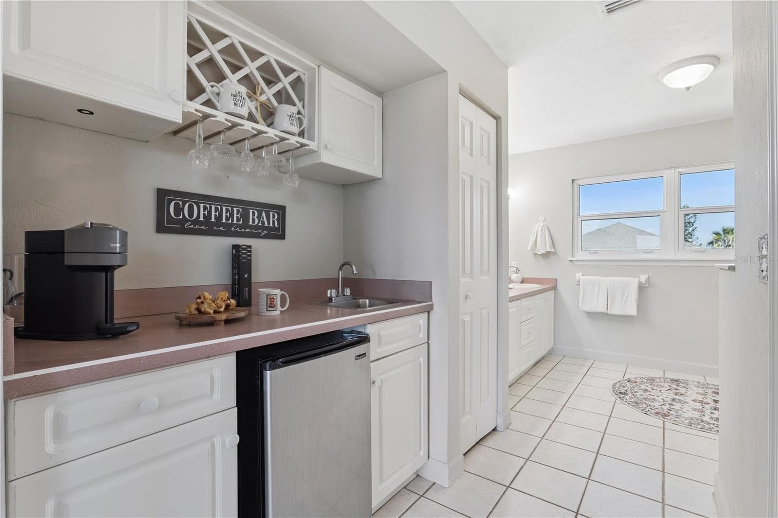 Coffee bar with mini frig and sink. - 884 CATFISH AVE, NEW SMYRNA BEACH