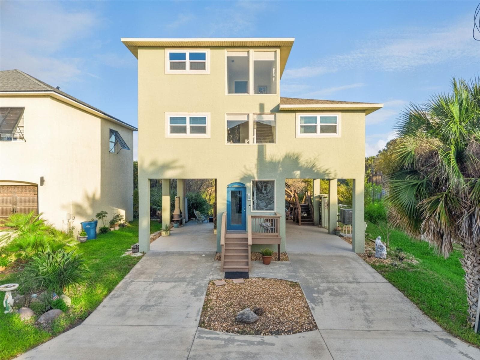Covered carport with high ceilings for your truck, car, boat, Airstream travel trailer or golf cart. 30x13 and 12' ceilings. - 884 CATFISH AVE, NEW SMYRNA BEACH