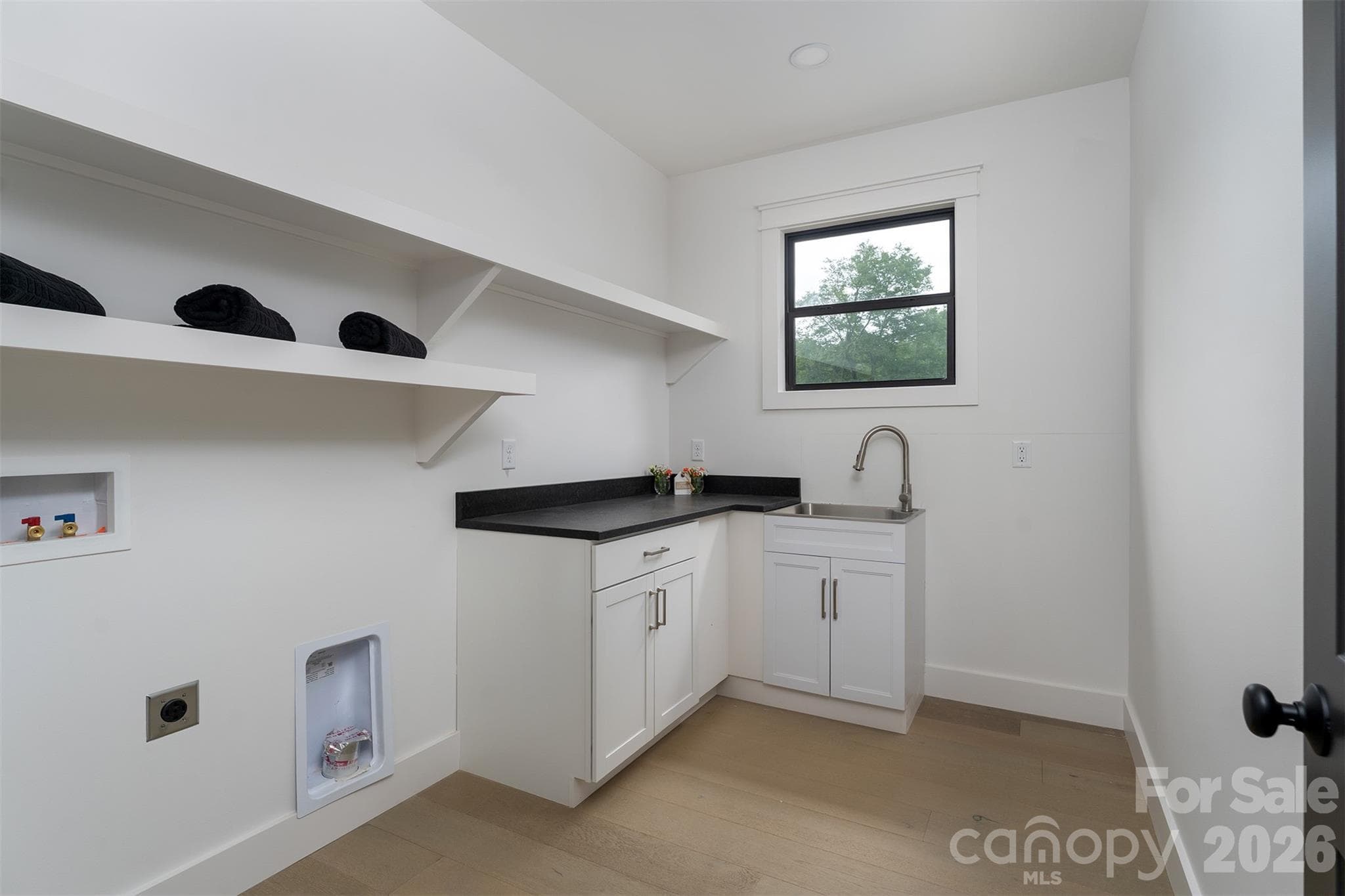 Large laundry room off garage with washer/dryer conveying - 808 Maybank Drive, Hendersonville