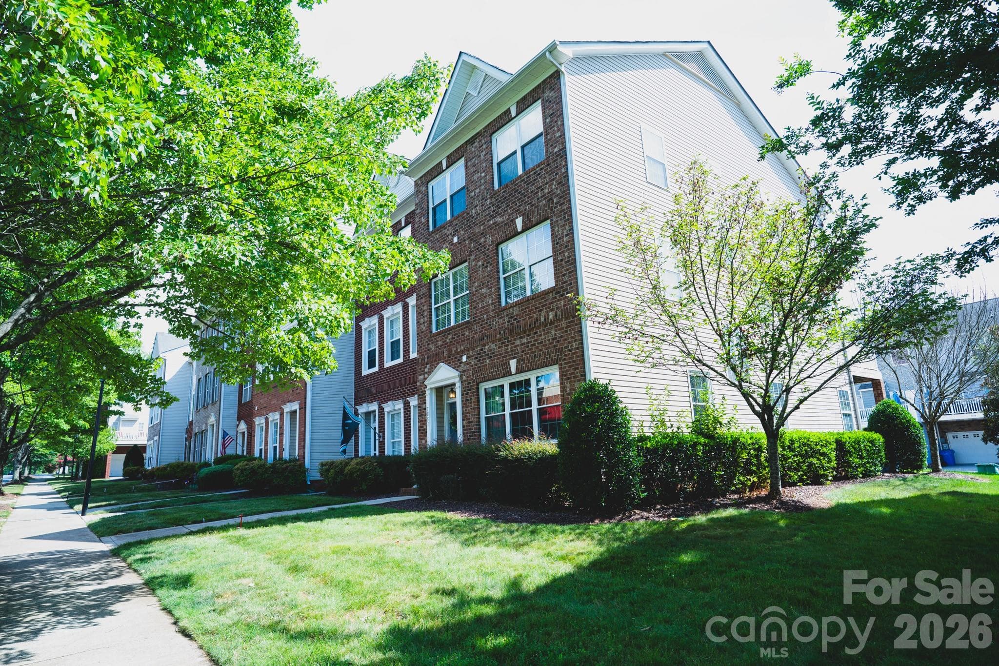 A 3 story end unit townhome with lots of windows for natural light. - Charlotte