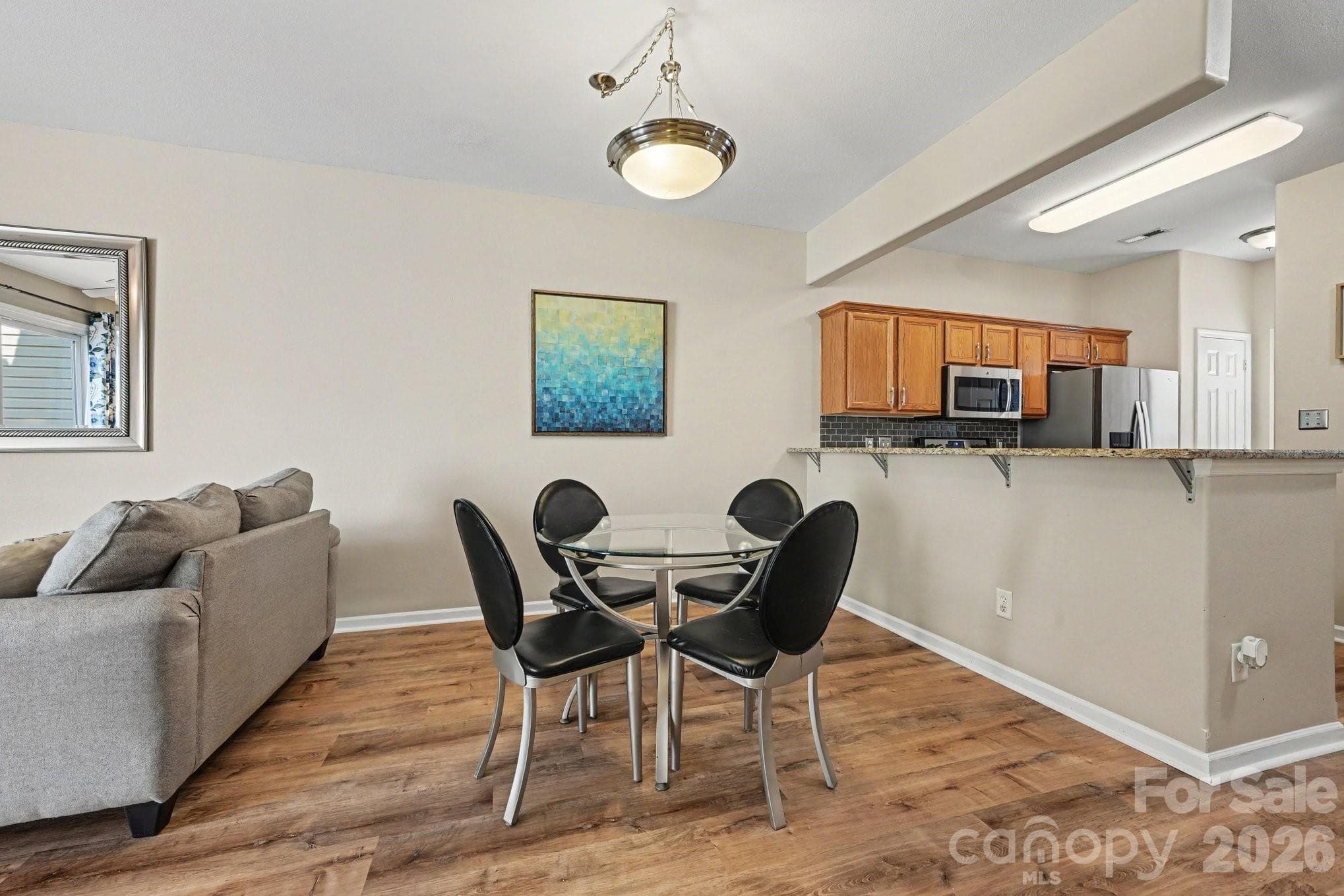 Dining area adjacent to kitchen. - 5338 Silabert Avenue, Charlotte