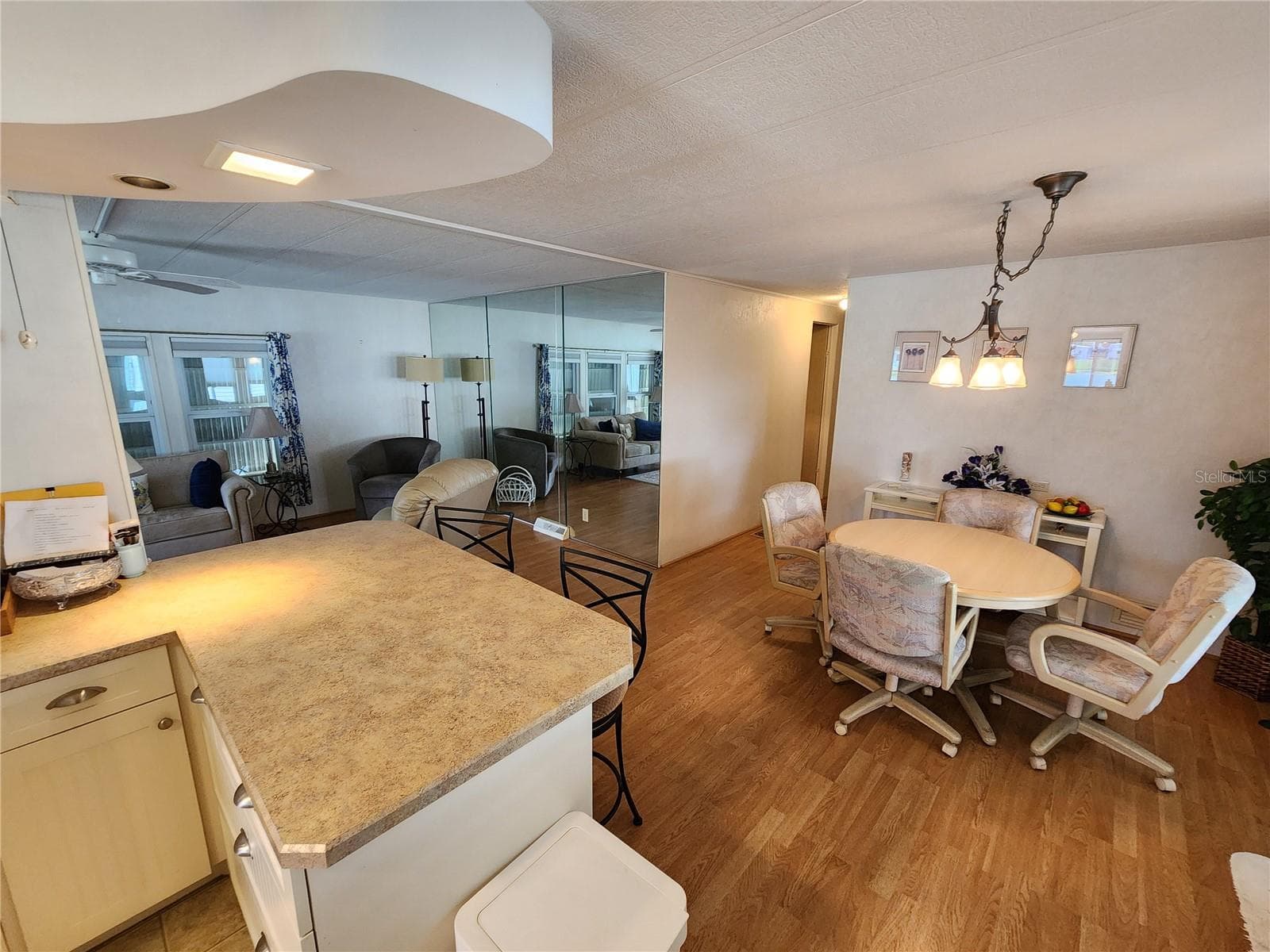 View into Dining Room/Living Room from Kitchen - 808 53RD AVE E #169, BRADENTON