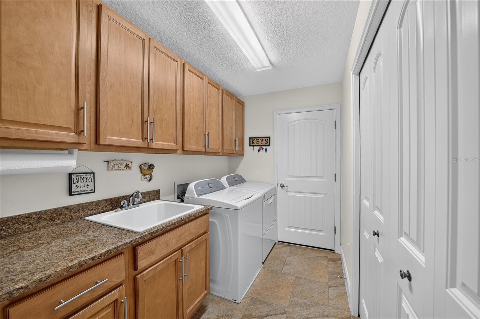 Laundry Room & doorway to garage - 16364 SE 89TH TER, SUMMERFIELD