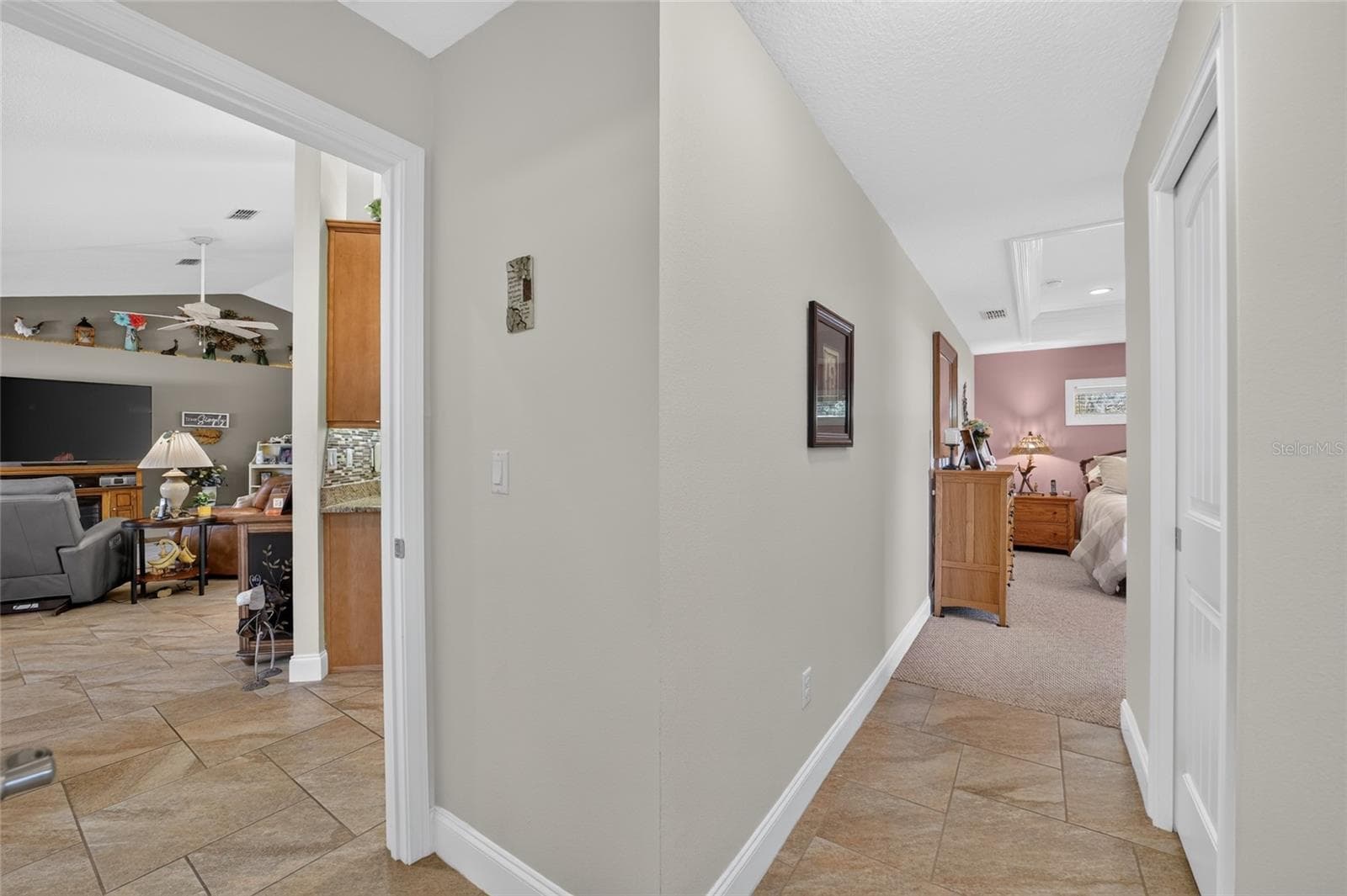 Hallway toward primary bedroom to right and living room to left - 16364 SE 89TH TER, SUMMERFIELD