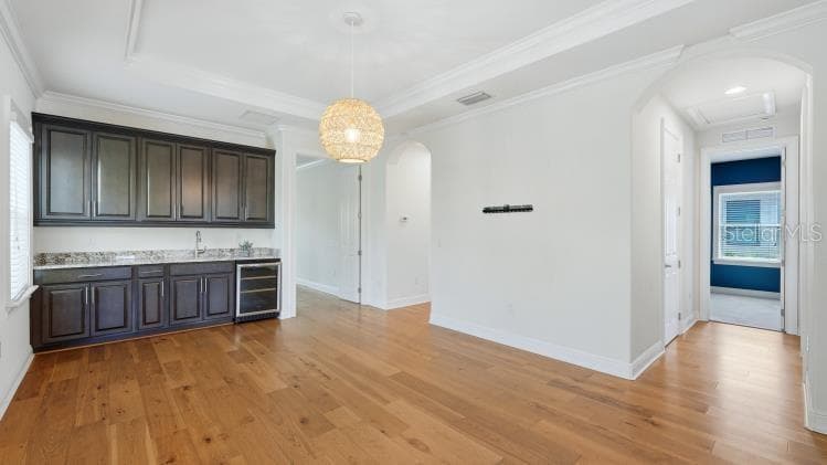 Custom storage with sink and beverage cooler in family room - 1850 MAGNOLIA ST, SARASOTA