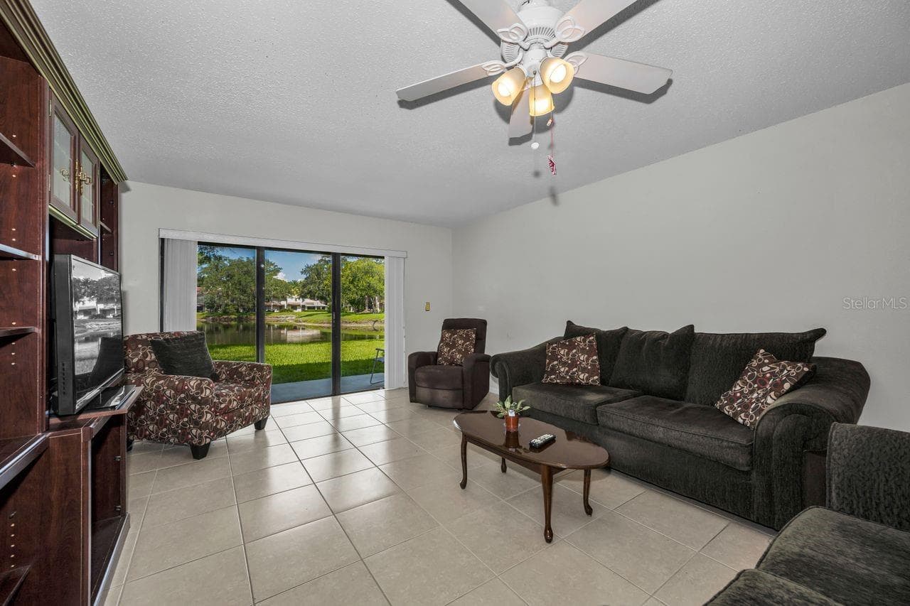 living room w/pond view - 3505 TARPON WOODS BLVD #O-403, PALM HARBOR