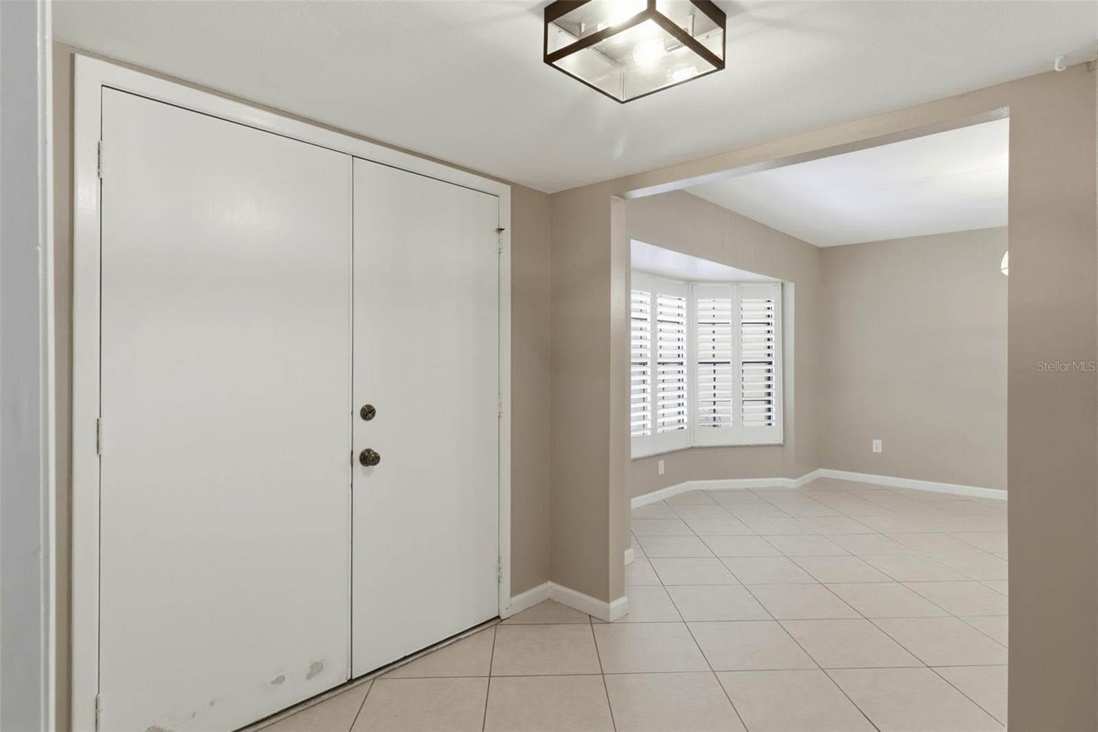 Enter the home through double doors looking into dining room to the left and office/flex room to the right - 302 BLOOMINGFIELD DR, BRANDON