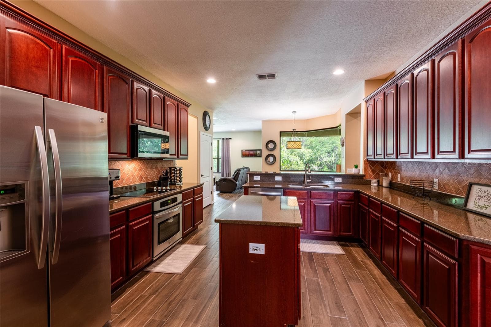 large kitchen w/ stainless steel appliances - 14815 NINEBARK CT, LAND O LAKES