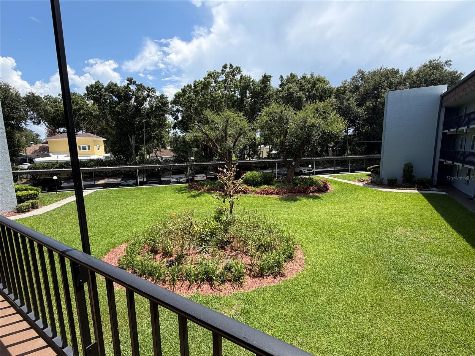 lush landscaping - 333 LAKE HOWARD DR NW #211B, WINTER HAVEN