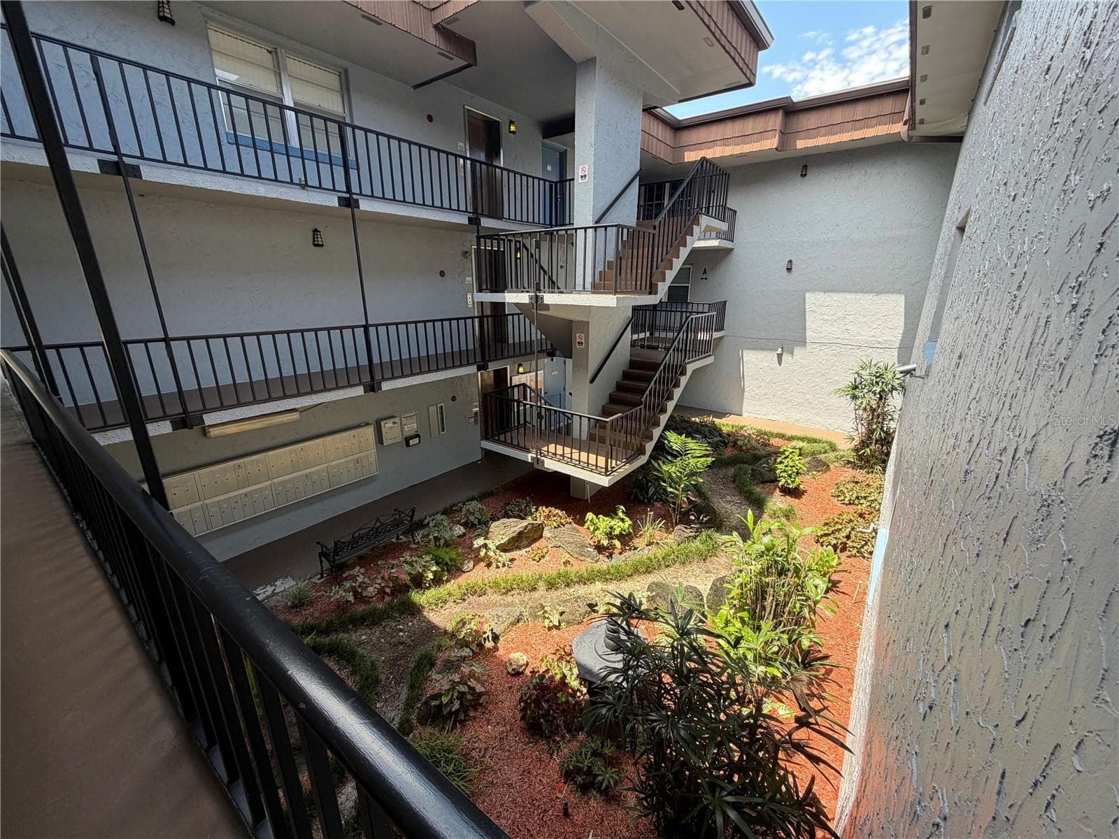 lush landscaping - 333 LAKE HOWARD DR NW #211B, WINTER HAVEN