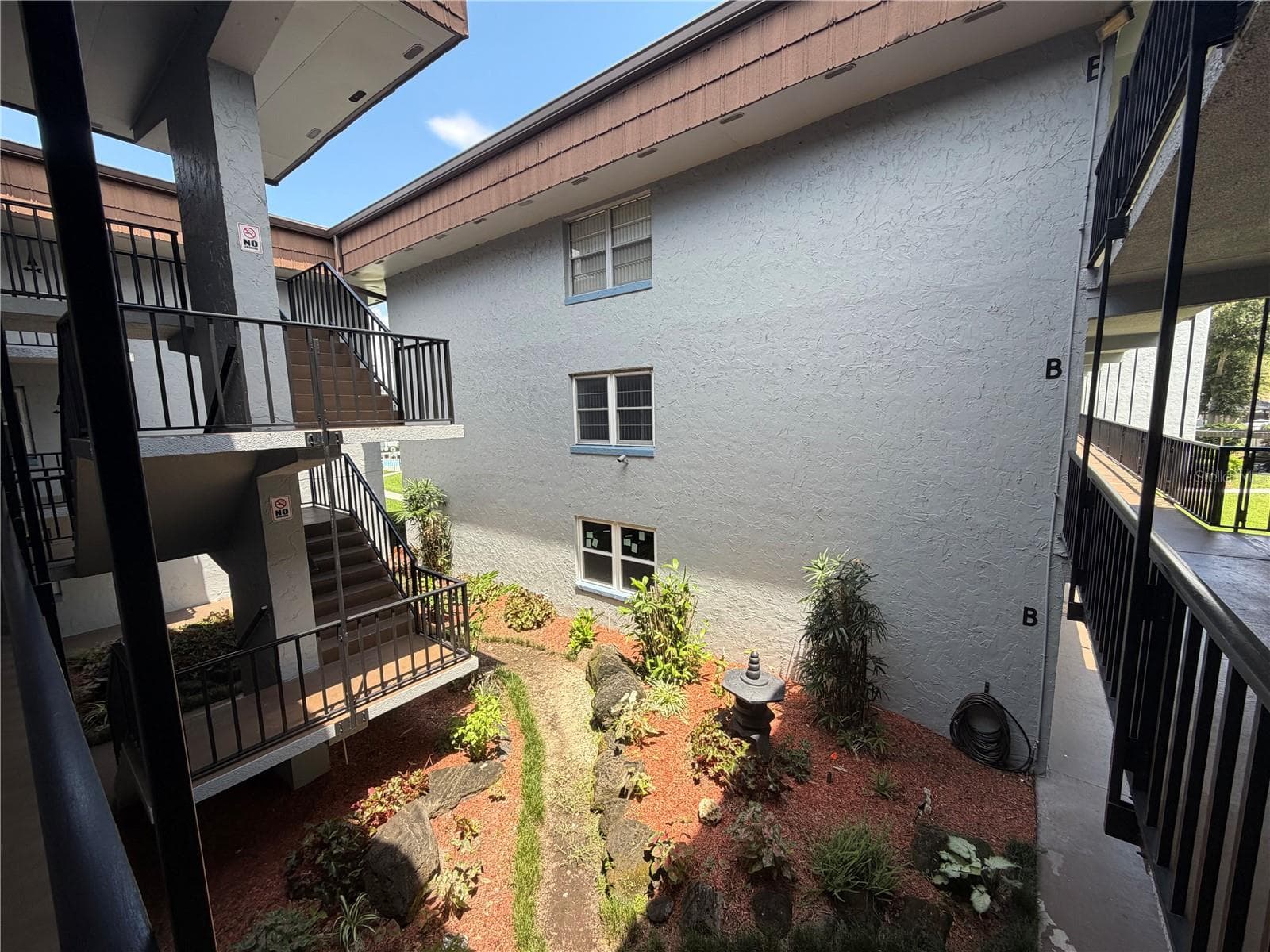 lush landscaping - 333 LAKE HOWARD DR NW #211B, WINTER HAVEN