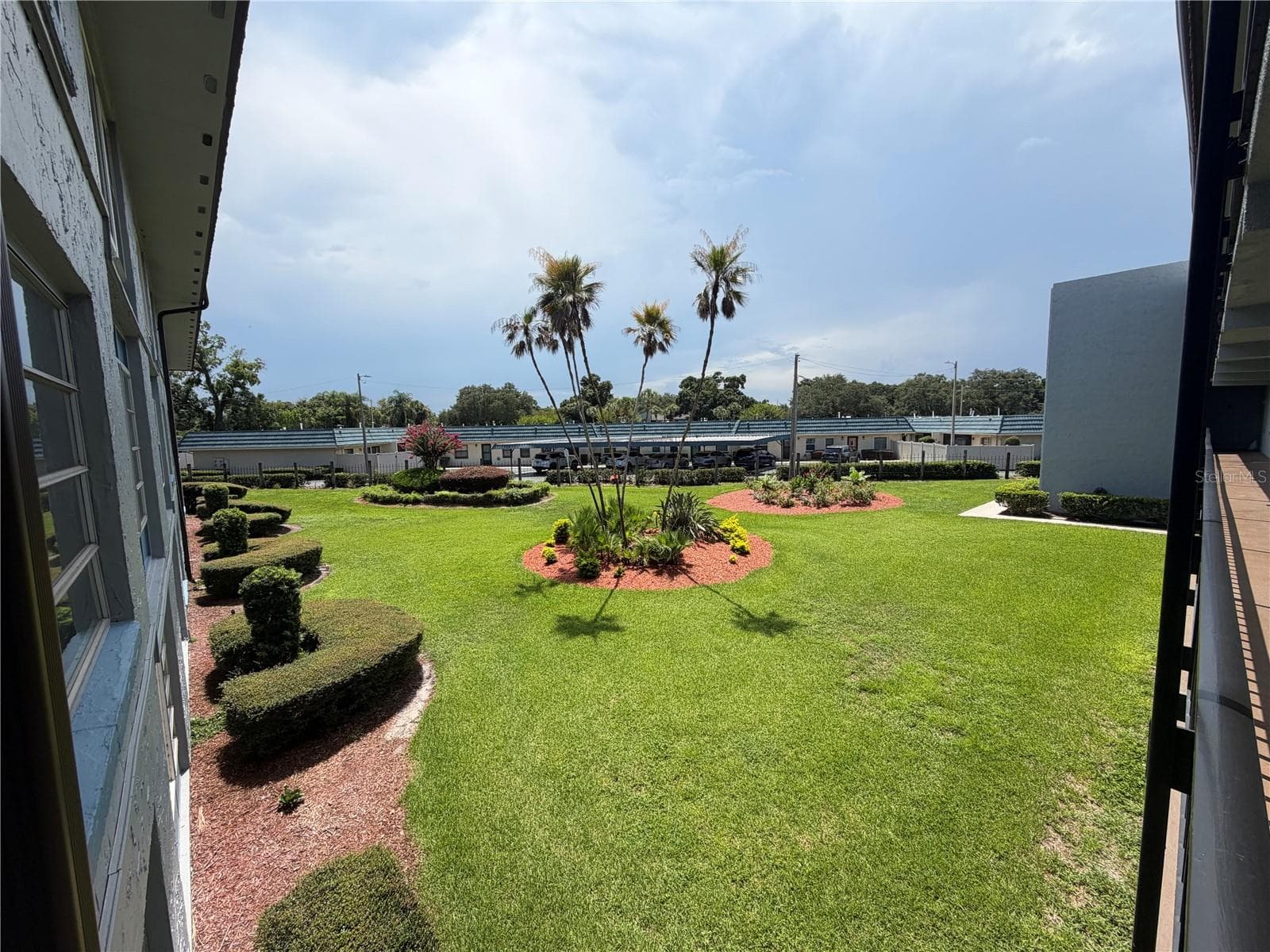lush landscaping - 333 LAKE HOWARD DR NW #211B, WINTER HAVEN