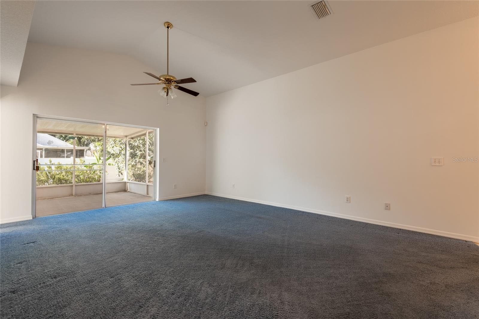 Vaulted ceiling in the living room. Freshly painted interior. - 1914 WOODCUT DR, LUTZ