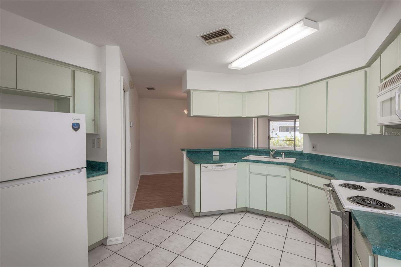 Lots of storage in the spacious kitchen. - 1914 WOODCUT DR, LUTZ