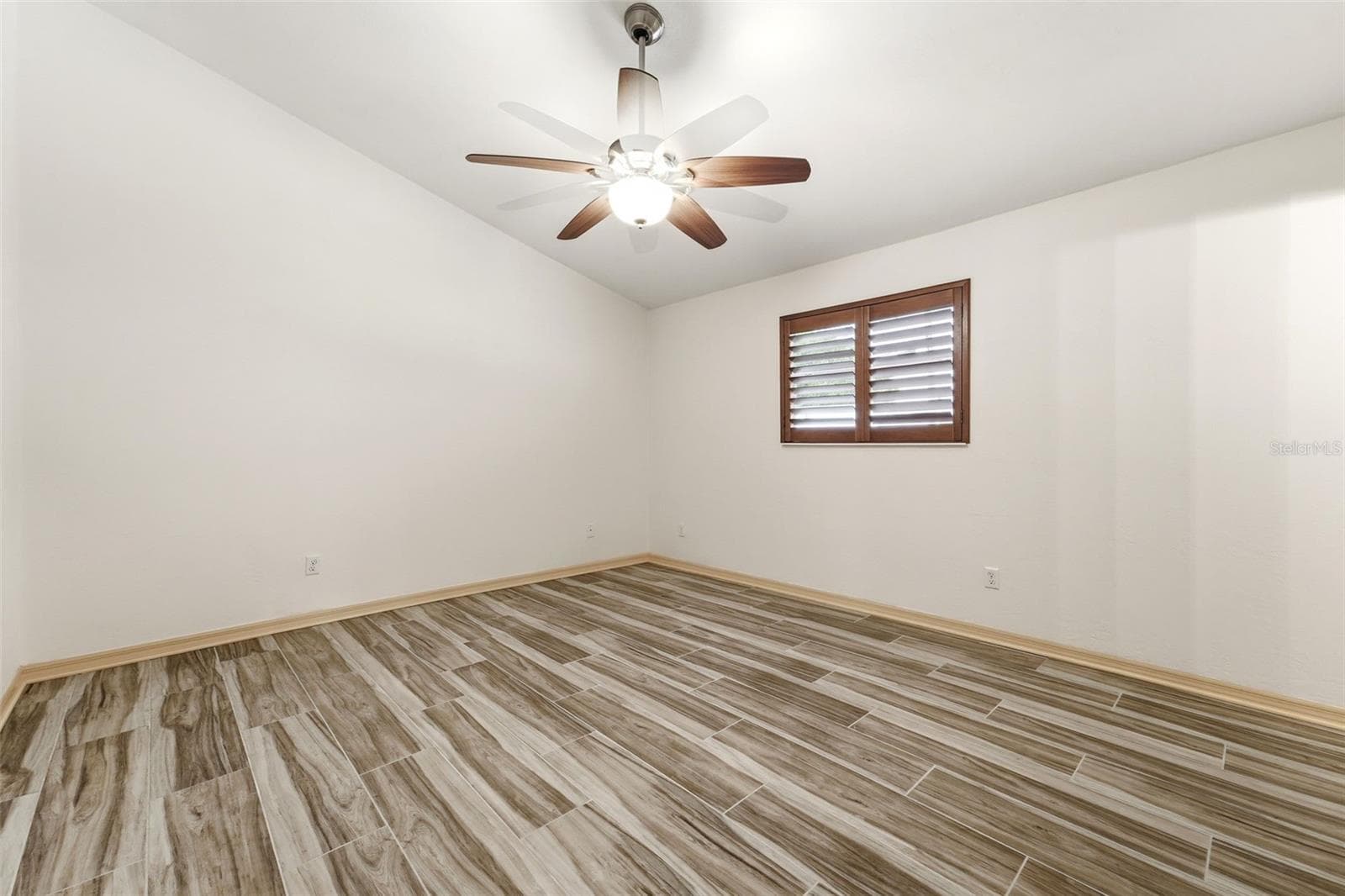 Bedroom three with comfortable secondary bedroom with generous natural light. - 59 CRESTWOOD CIR, ORMOND BEACH
