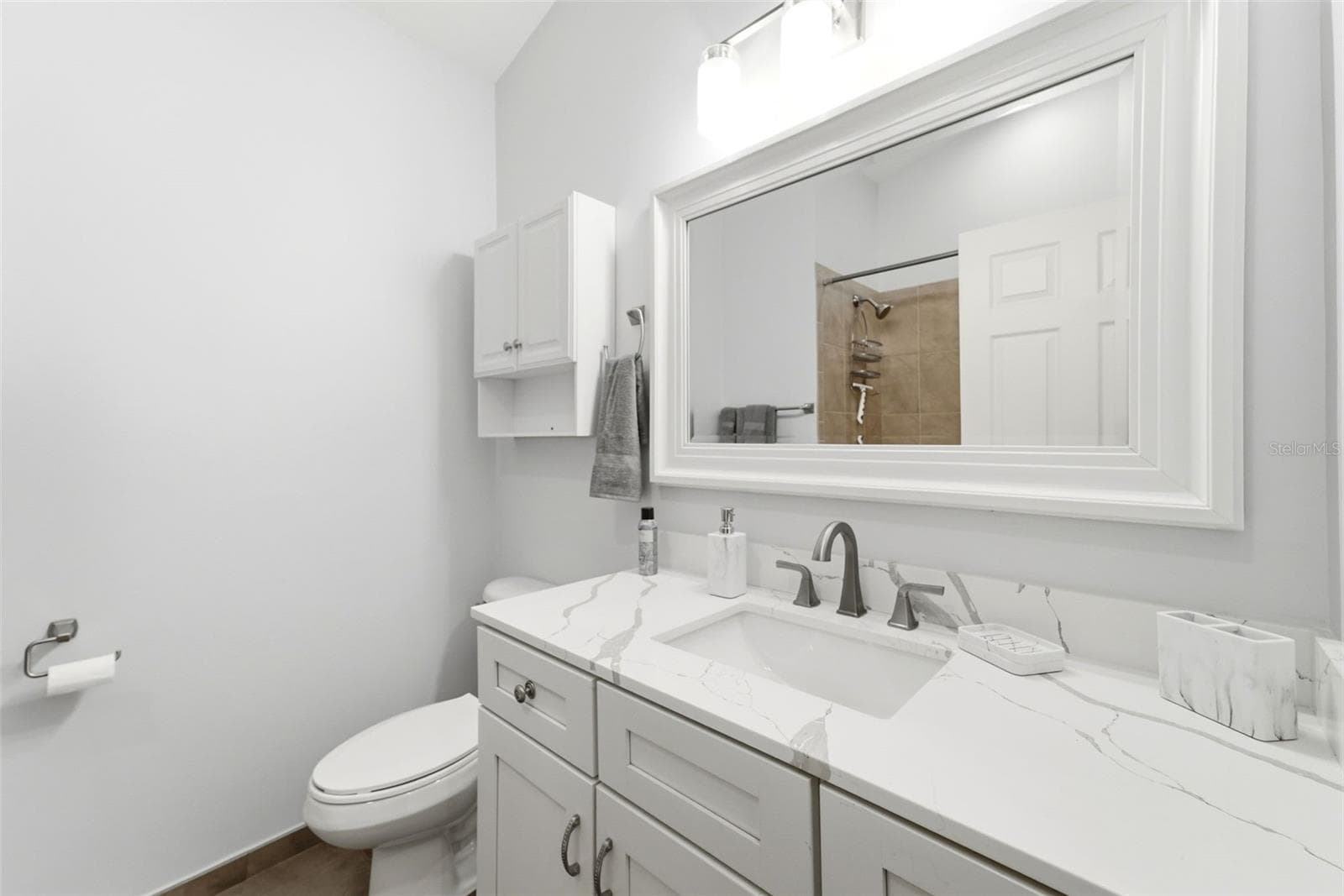 Recently updated with quartz countertops, modern fixtures, and timeless finishes. - 59 CRESTWOOD CIR, ORMOND BEACH