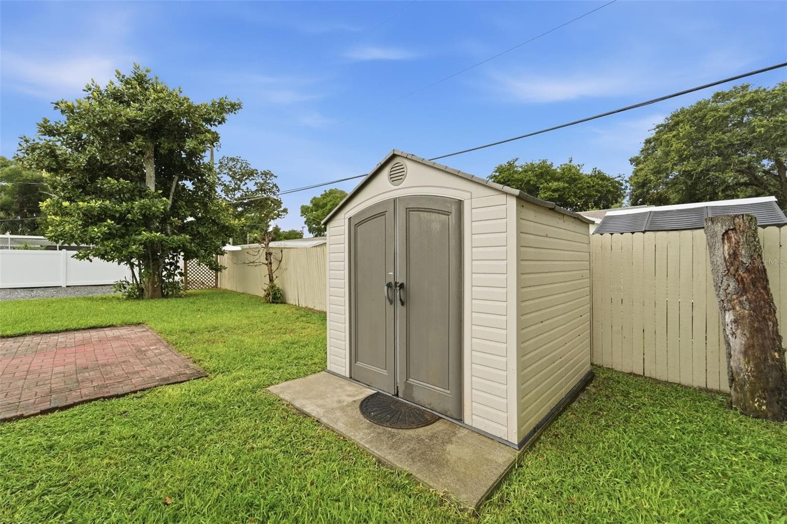 Additional outdoor storage provides even more flexibility for tools and equipment. - 59 CRESTWOOD CIR, ORMOND BEACH