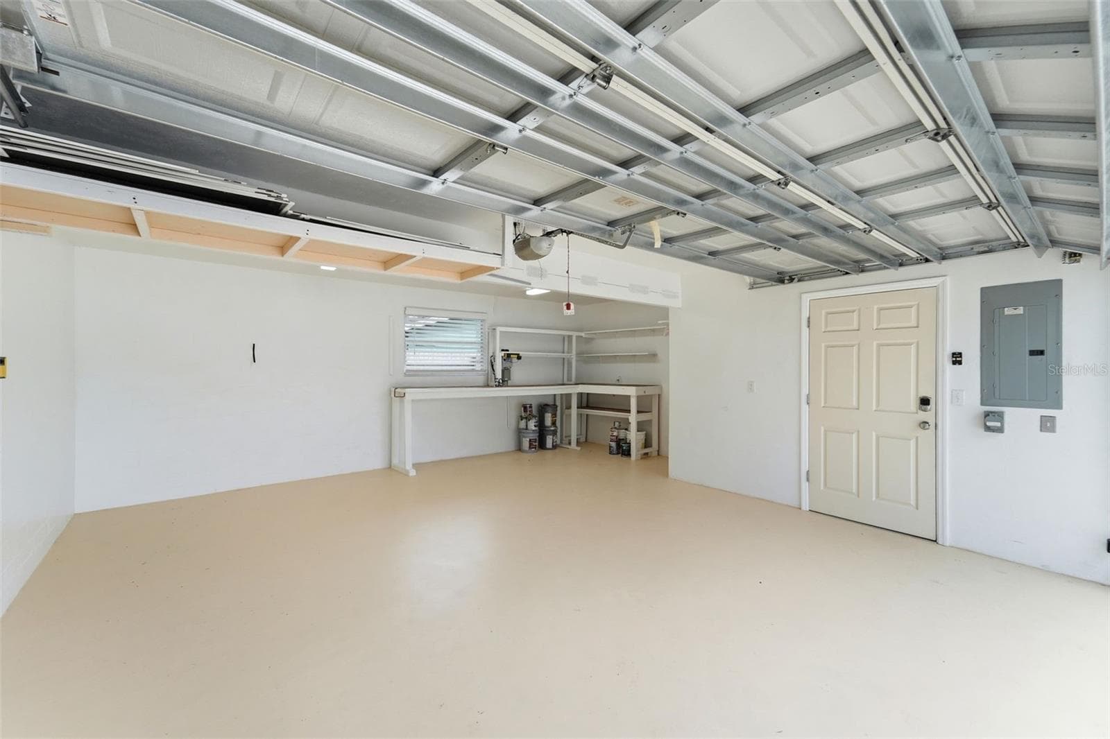 An oversized garage that's as clean and organized as the rest of the home. - 59 CRESTWOOD CIR, ORMOND BEACH