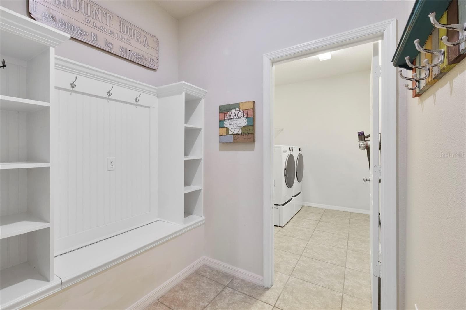 TO YOUR RIGHT IS THE MUDROOM AND LAUNDRY ROOM - 21315 SORRAIA CV, MOUNT DORA