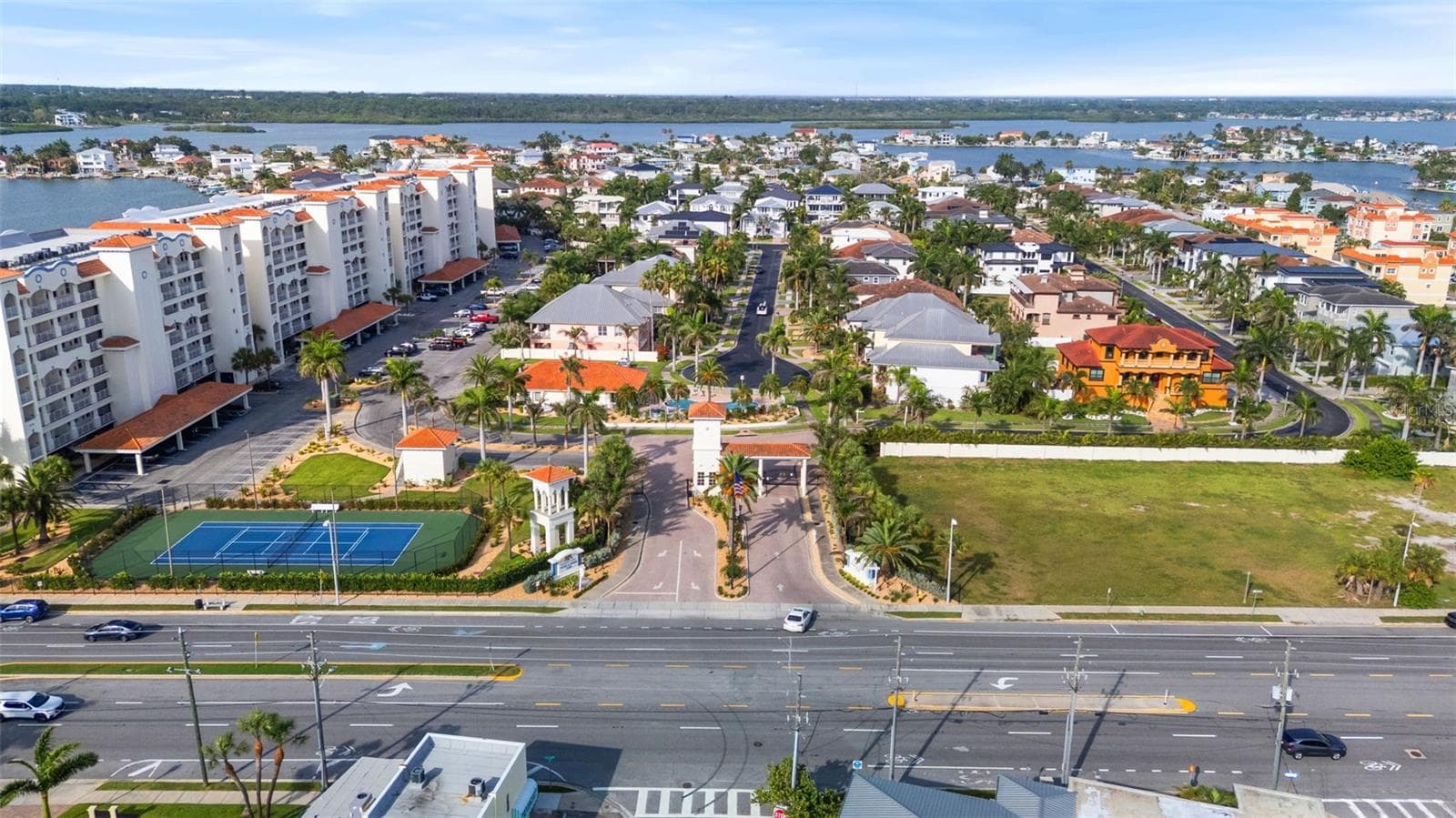 Community over view: from left : •4 condo buildings (waterfront pools , docks , and boardwalks.•tennis courts, parking lot, community clubhouse ( center ) guard gate ( center ) •single family homes to right . All gated and secured . Sitting in Boca CIEGA - 17717 GULF BLVD #604, REDINGTON SHORES