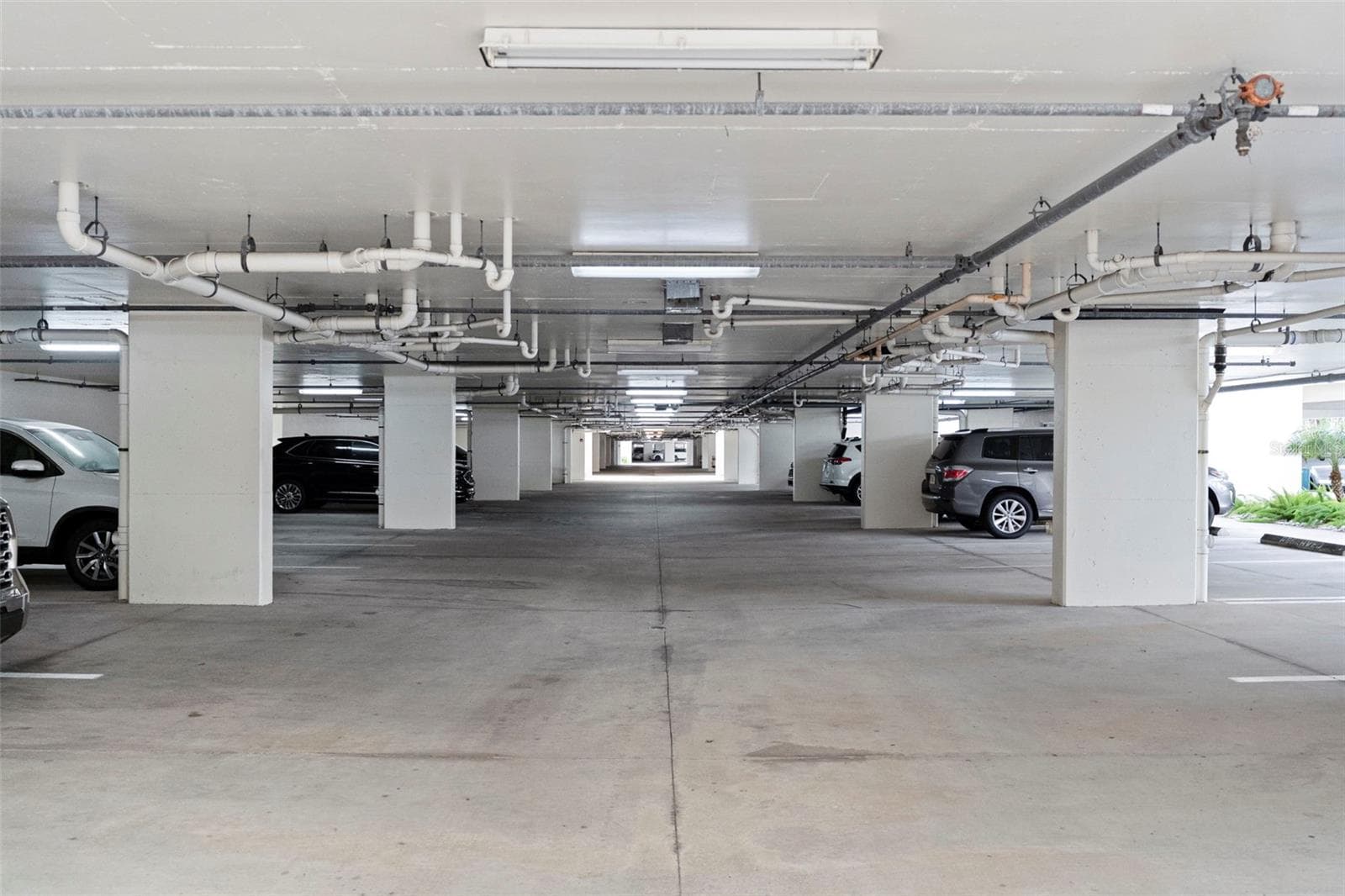 Under Building assigned parking ( mailboxes, recycling , lobby with cart for residents to use , and doors leading to pool area - 17717 GULF BLVD #604, REDINGTON SHORES