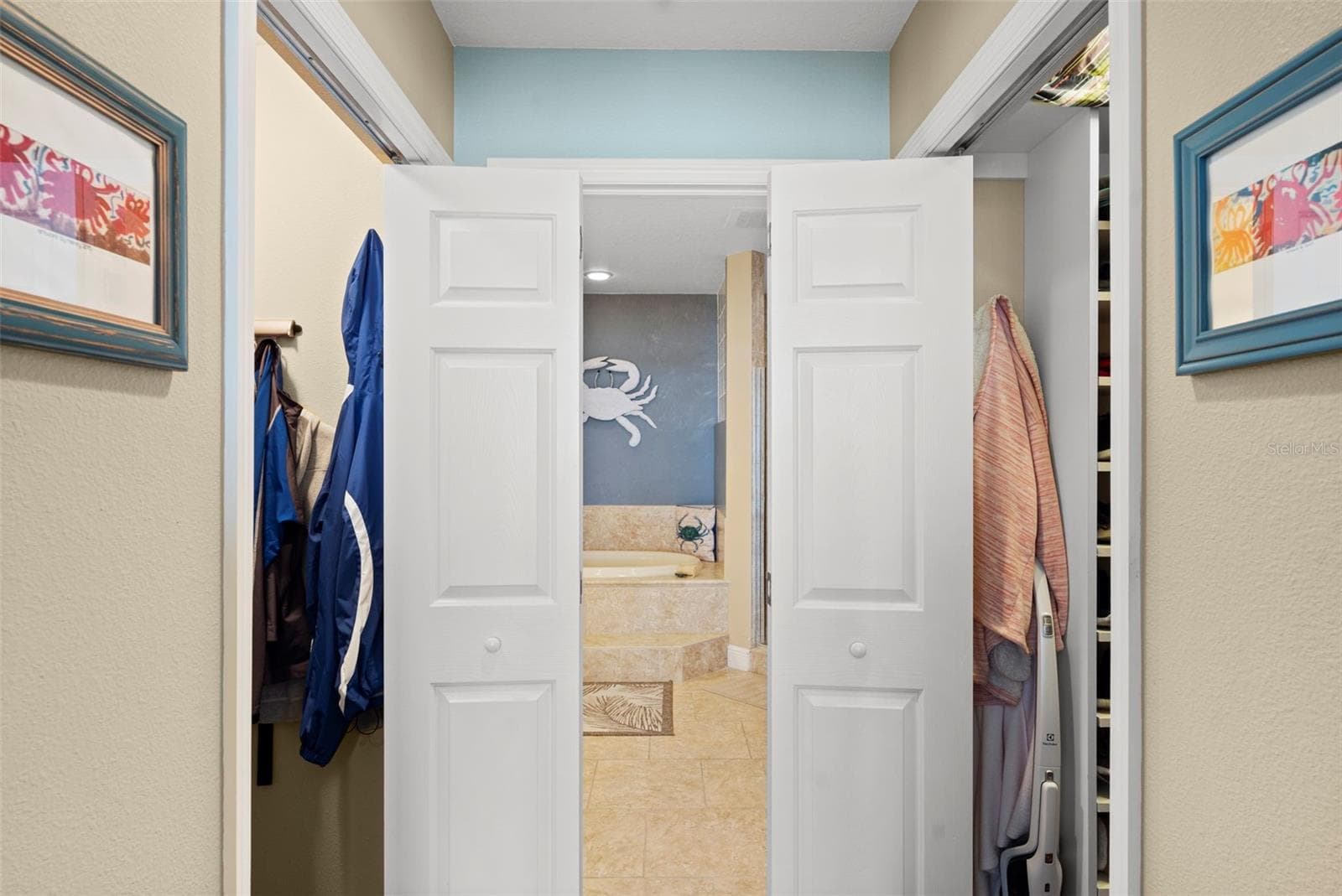 Primary en-suite closet to bathroom entry hall - 17717 GULF BLVD #604, REDINGTON SHORES