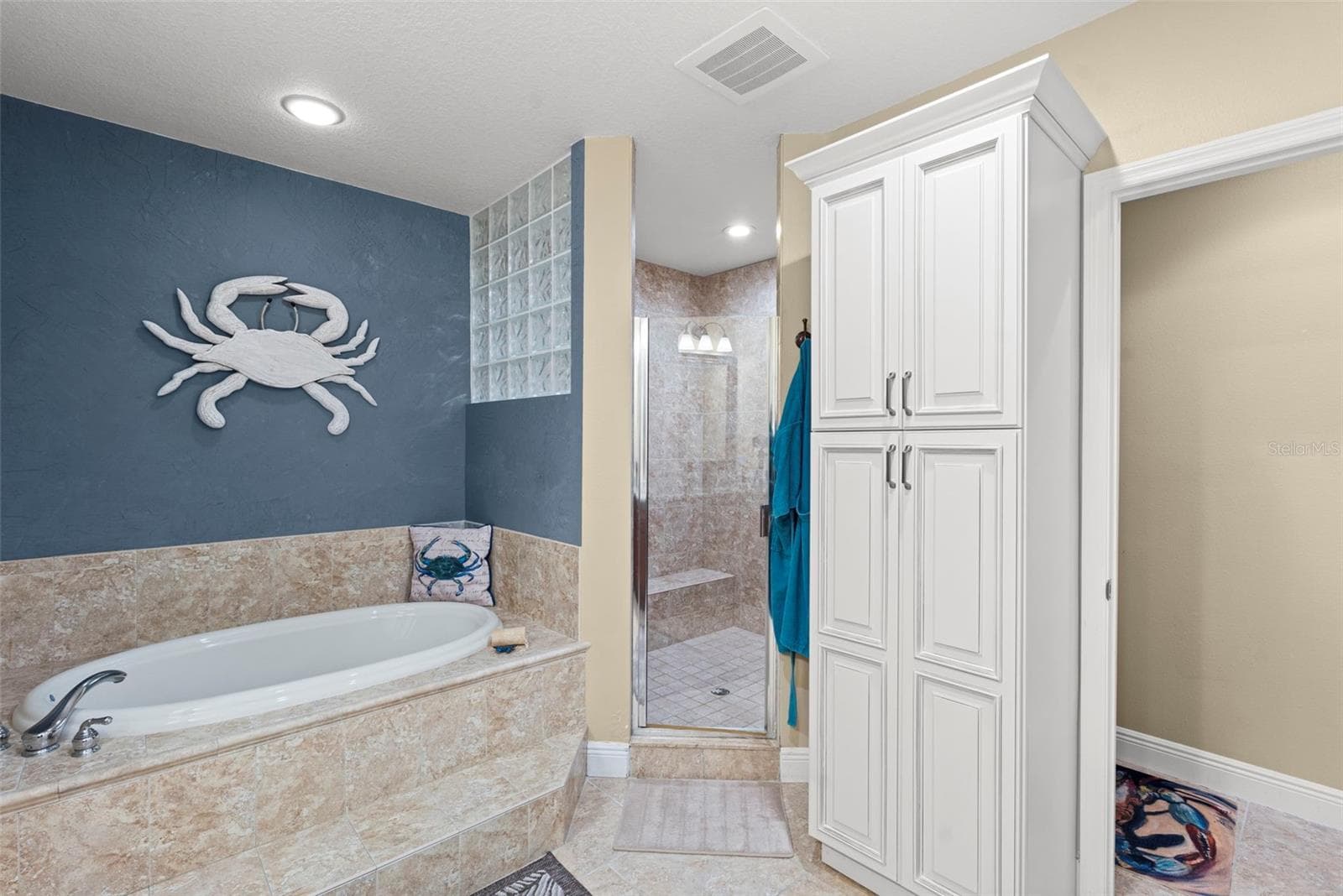 Primary bath garden soaking tub to stand in glass enclosed shower with bench - 17717 GULF BLVD #604, REDINGTON SHORES