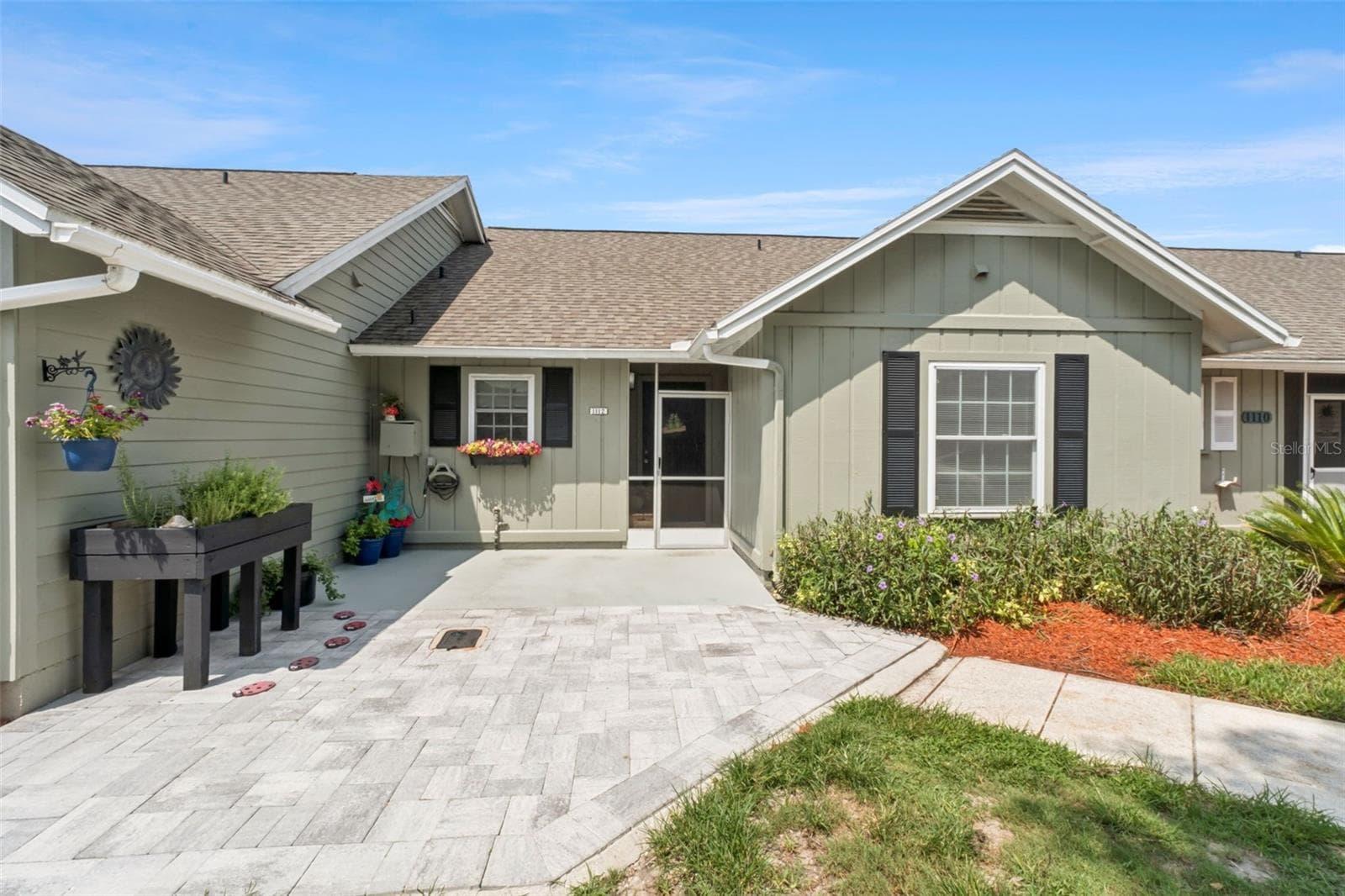 All new extended brick pavers for a large inviting front area. - 1112 VILLA LN #84, APOPKA