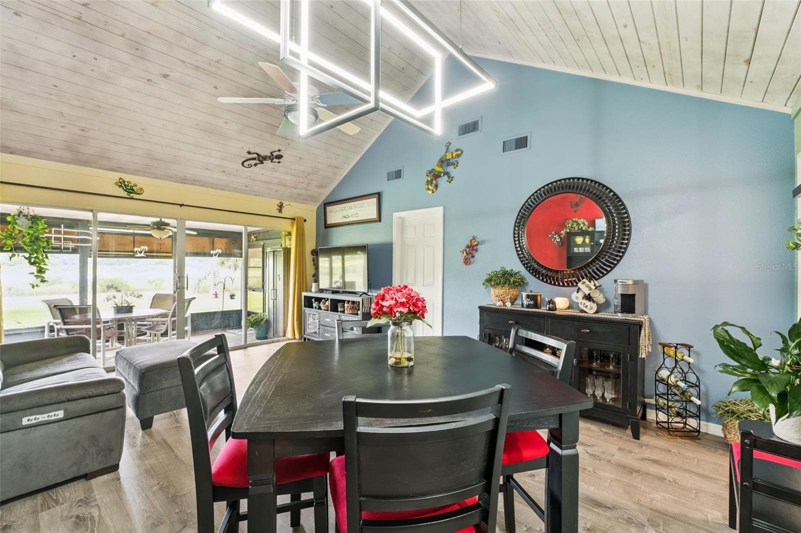 Dining room area. Dining room table and chairs will stay as well as coffee bar. - 1112 VILLA LN #84, APOPKA