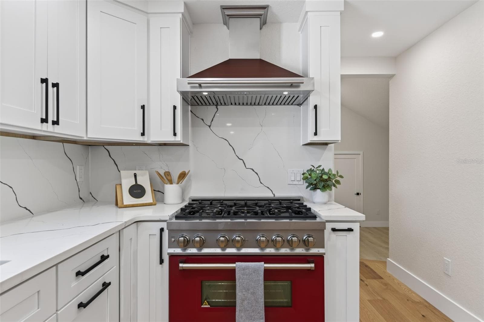 The red range is the centerpiece of the kitchen - 310 PARK ST N, ST PETERSBURG