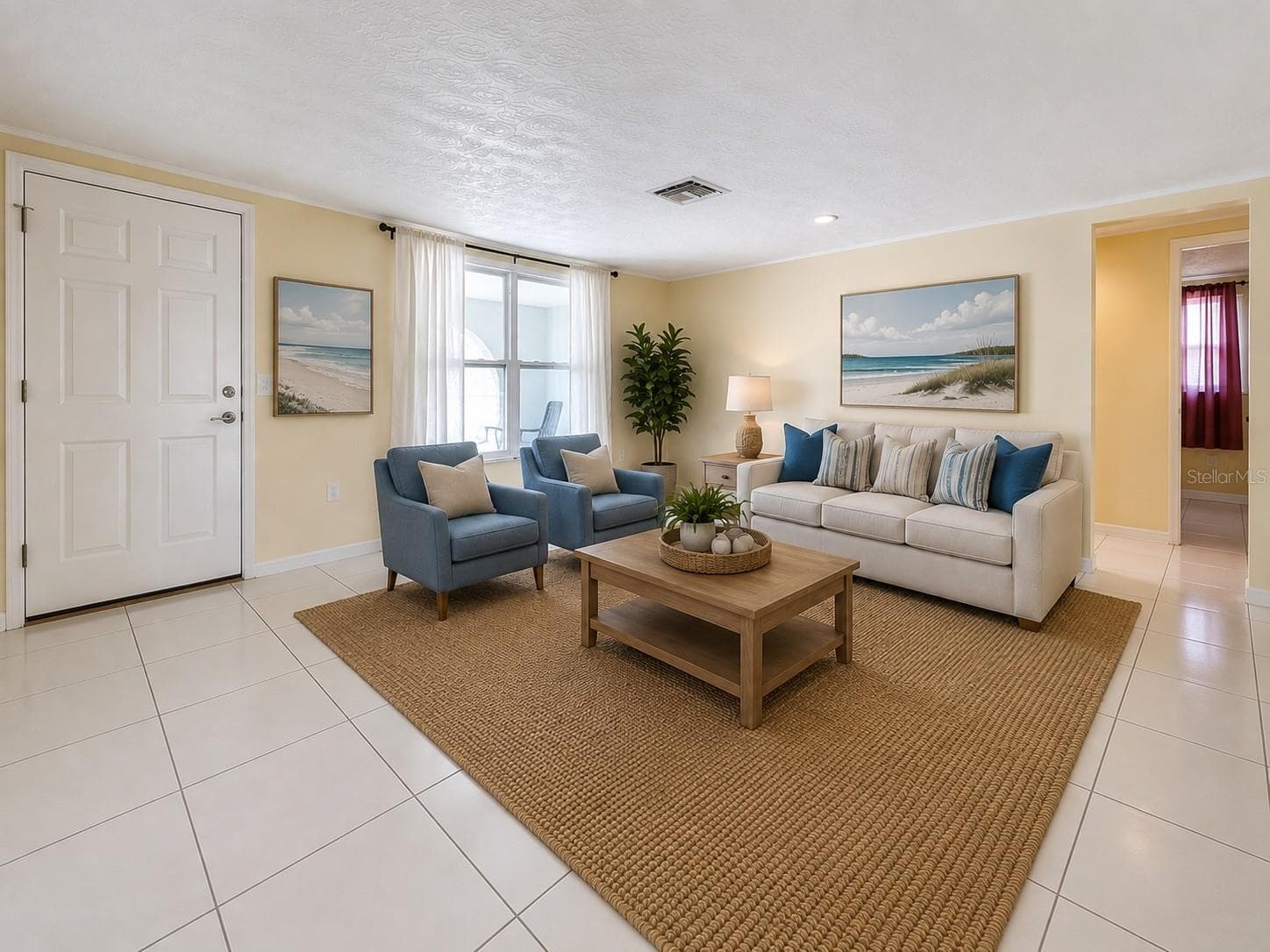 Front living room-staged - 7401 ISLANDER LN, HUDSON
