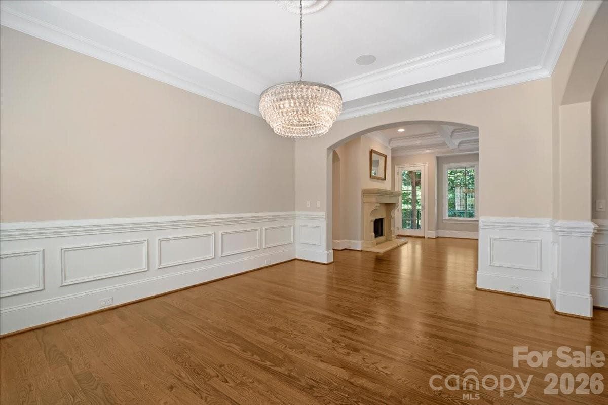 Framed by elegant millwork and timeless architectural details, the formal dining room is equally suited for holiday celebrations and intimate dinners alike. - Charlotte