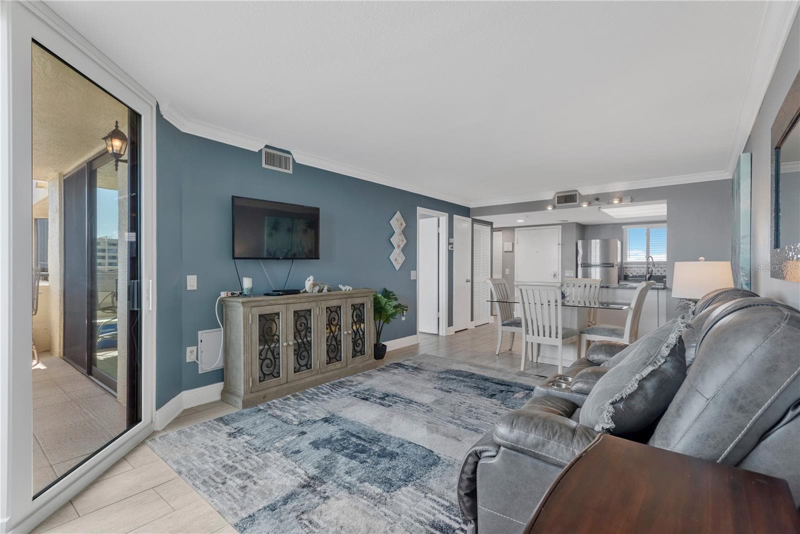 Spacious living area with view of sparkling Gulf waters from you wall of sliders. - 5915 SEA RANCH DR #503, HUDSON