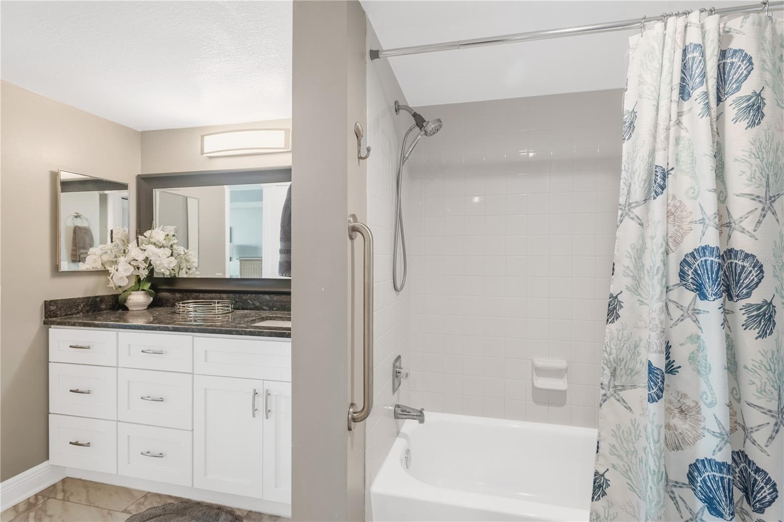 Master Bath with tub / shower combination, full tile. - 5915 SEA RANCH DR #503, HUDSON