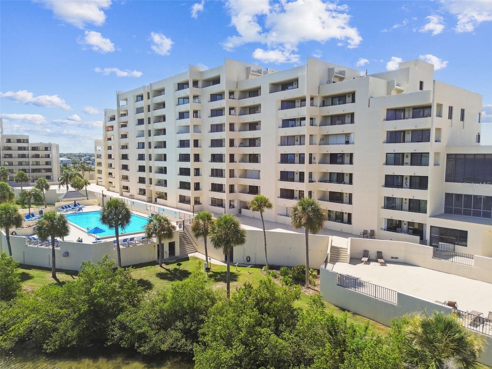 Another view of crystal blue pool. - 5915 SEA RANCH DR #503, HUDSON