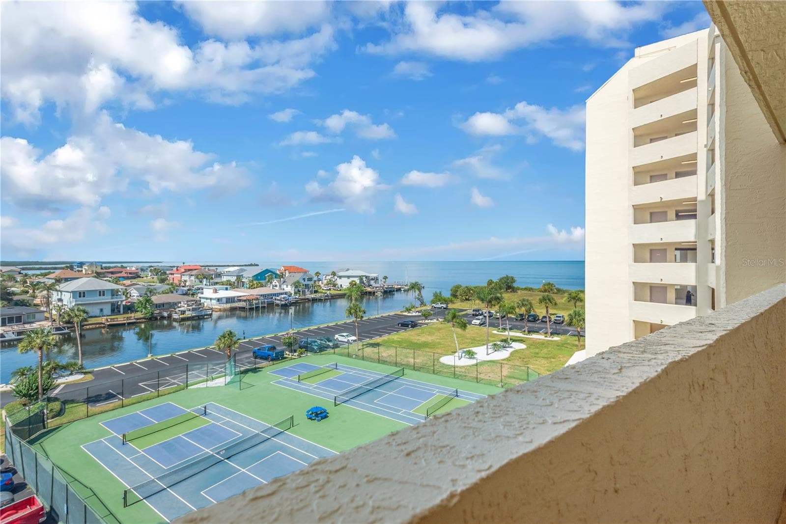 From you front walkway you can see the many tennis/pickle ball courts that can be enjoyed. - 5915 SEA RANCH DR #503, HUDSON
