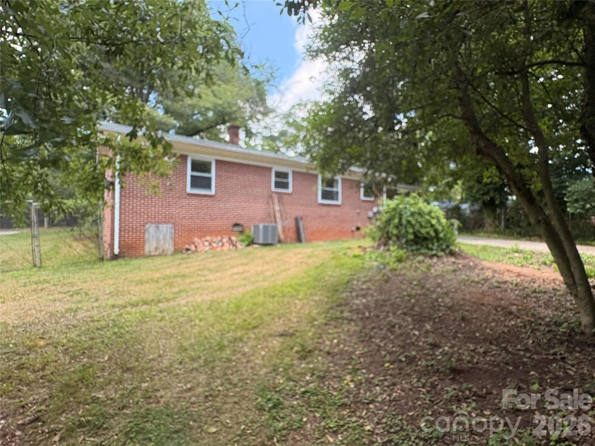 Back of home with fenced back yard on a total of .27 acres. - 725 5th Avenue SW, Hickory