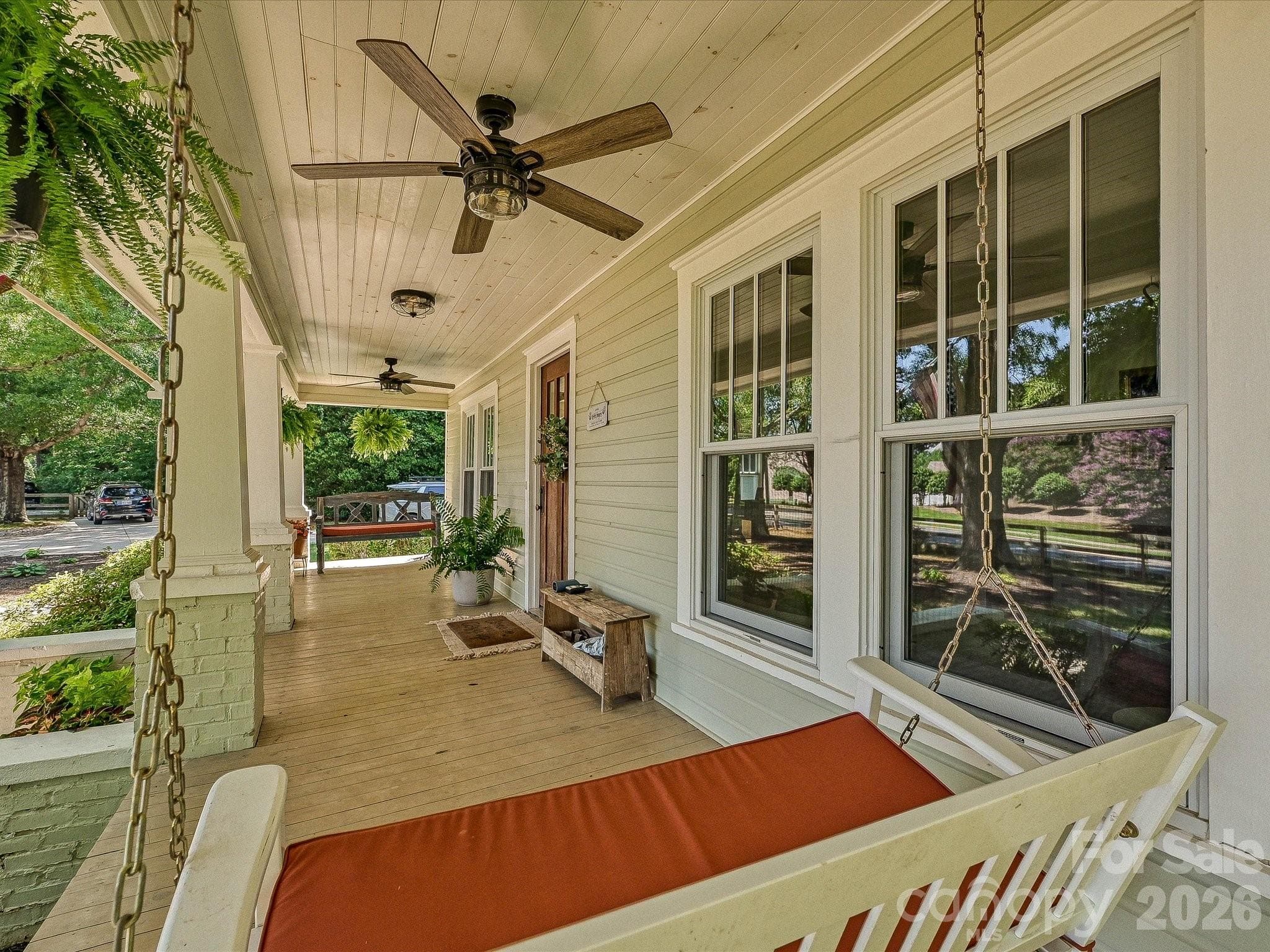 Relax and unwind on the expansive front porch, complete with a porch swing and plenty of space to enjoy peaceful mornings or evening gatherings. - 3514 Kelly Road, Charlotte