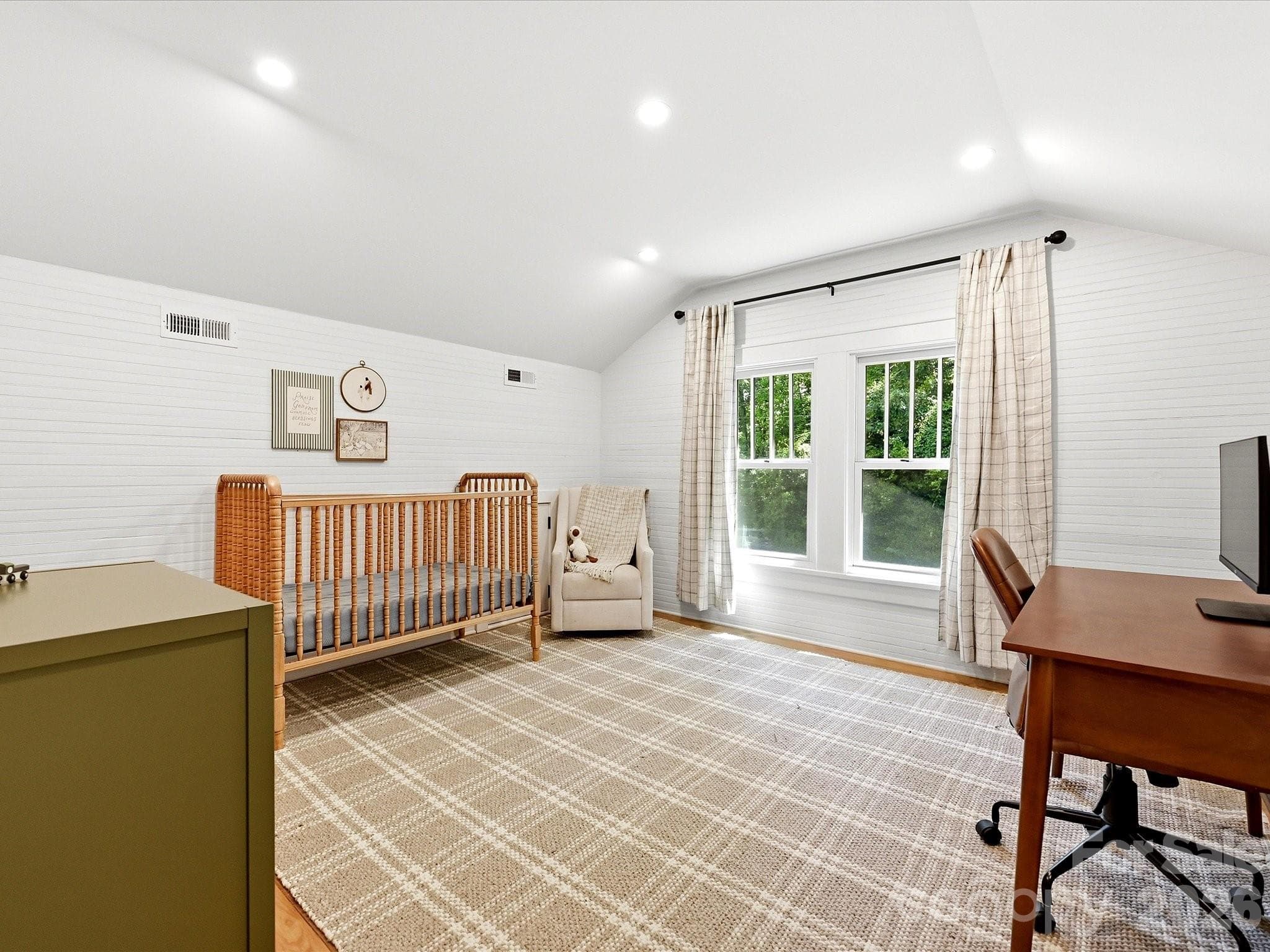 Offering exceptional flexibility, this oversized bedroom provides the perfect space for a nursery, home office, guest suite, or additional living area. - 3514 Kelly Road, Charlotte